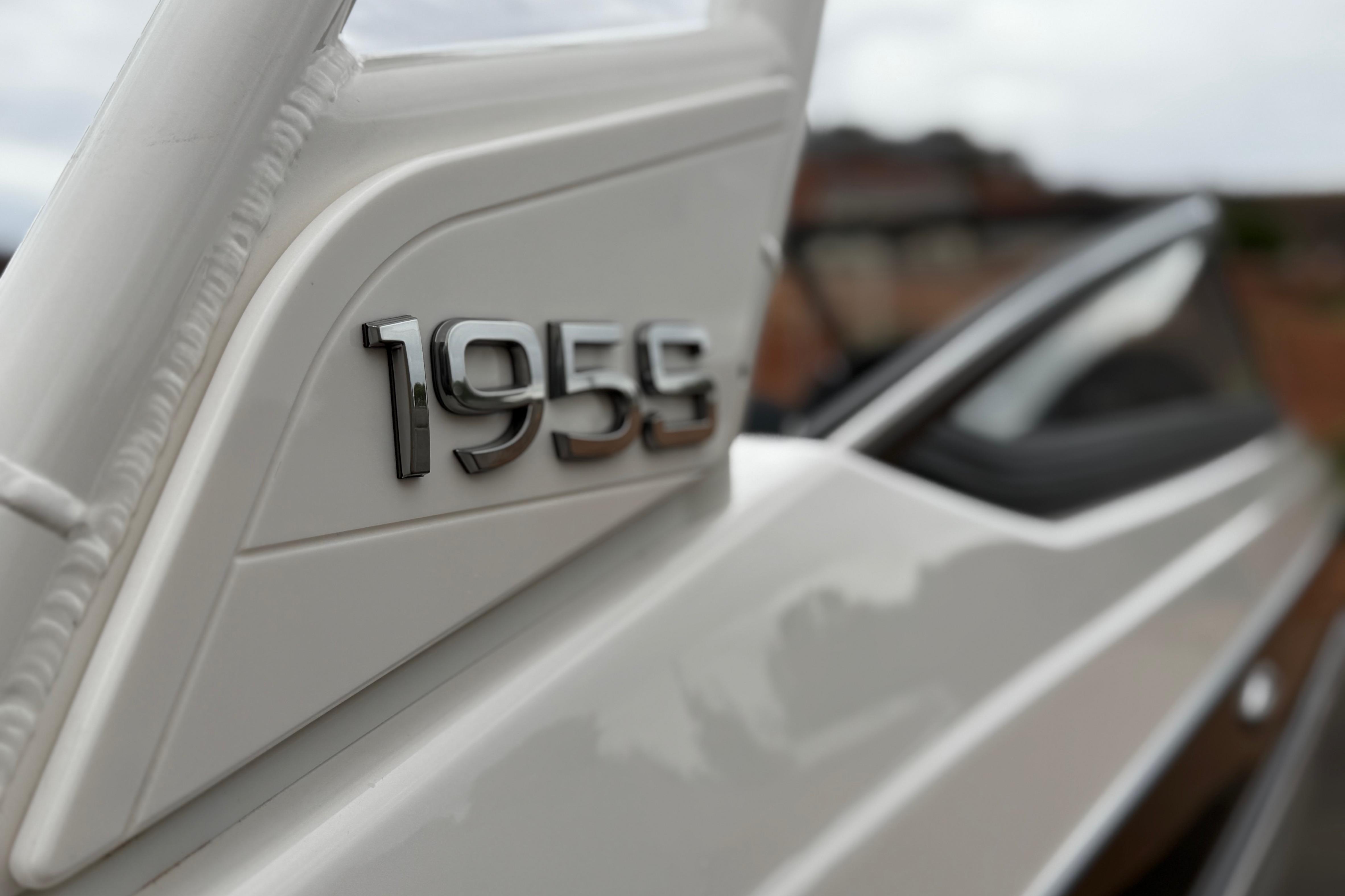 2025 Yamaha Boats 195S, close-up of model emblem on sleek white exterior.