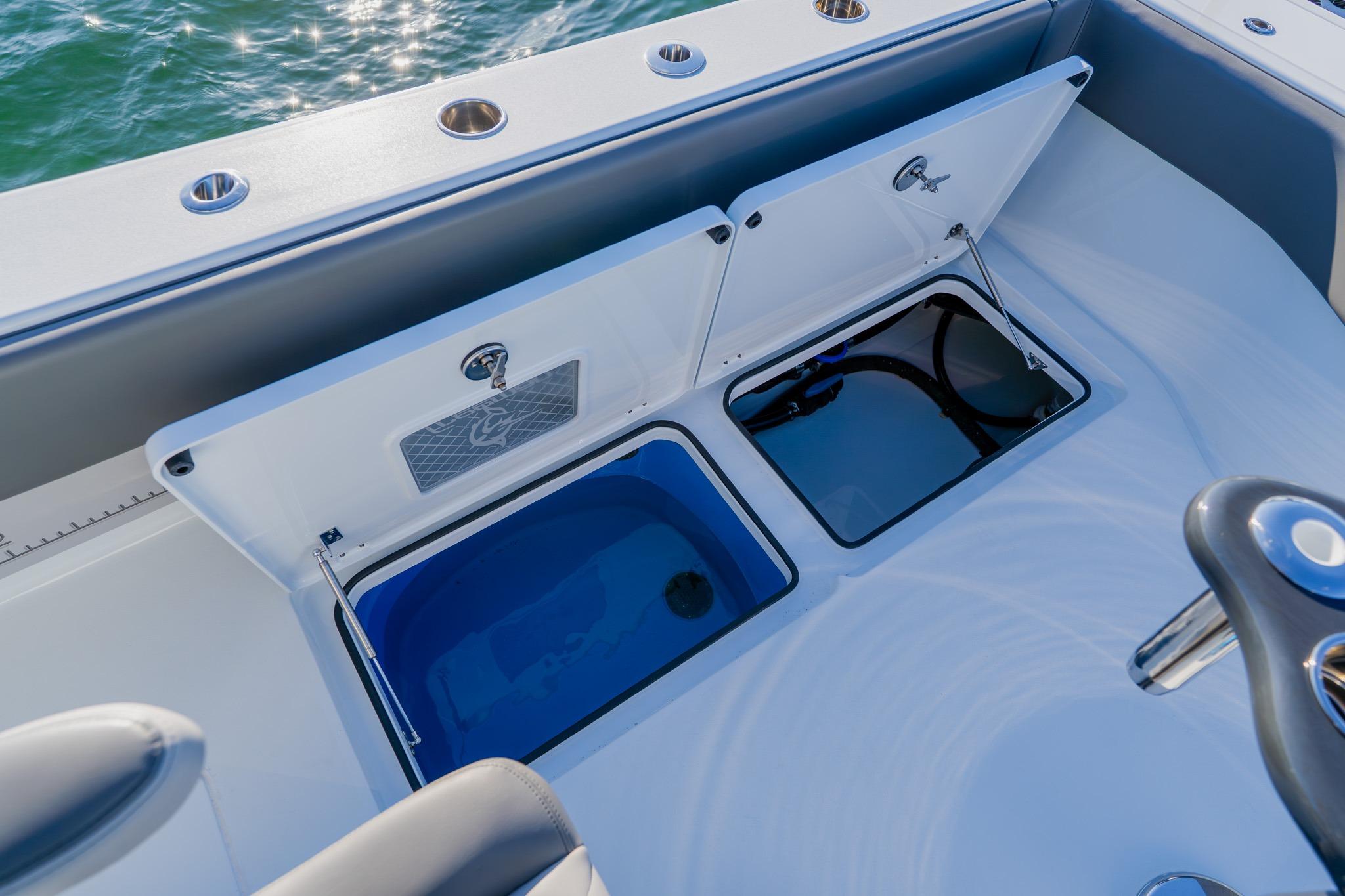 Freeman 42LR 2025 boat with open storage compartments on deck.
