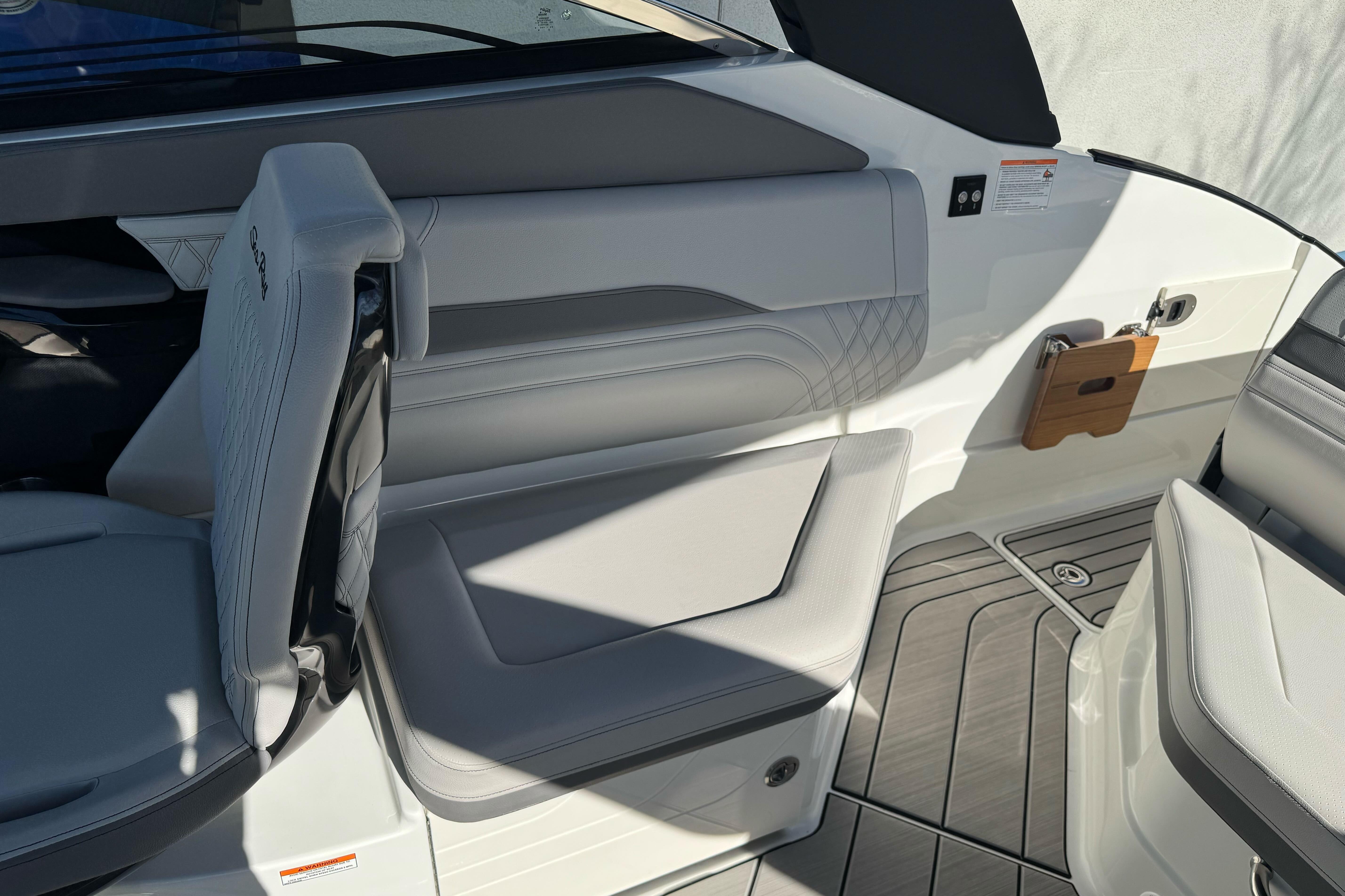 Interior of 2026 Sea Ray SLX 260 boat, featuring sleek seating and modern design.
