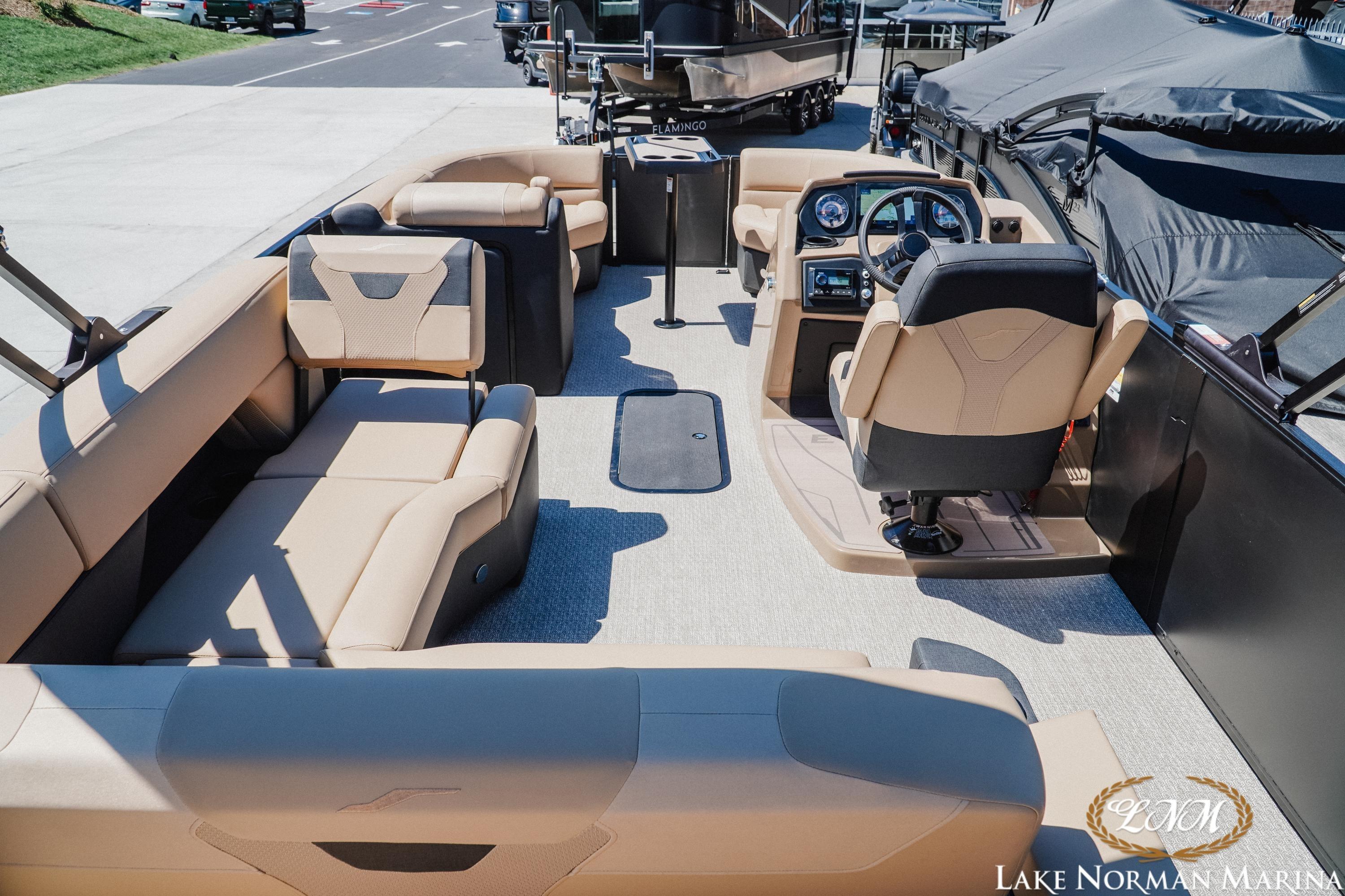 2026 Evotti 523CS boat interior with beige seating and modern dashboard at Lake Norman Marina.