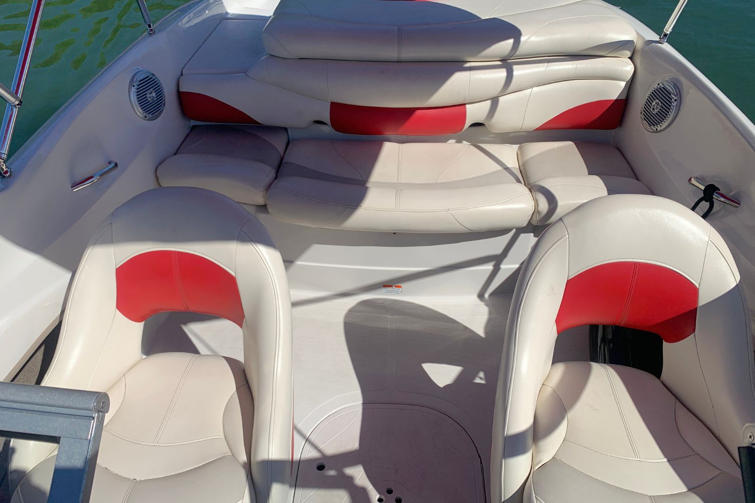 Interior of a 2012 Tahoe Q5i boat with red and white seating.