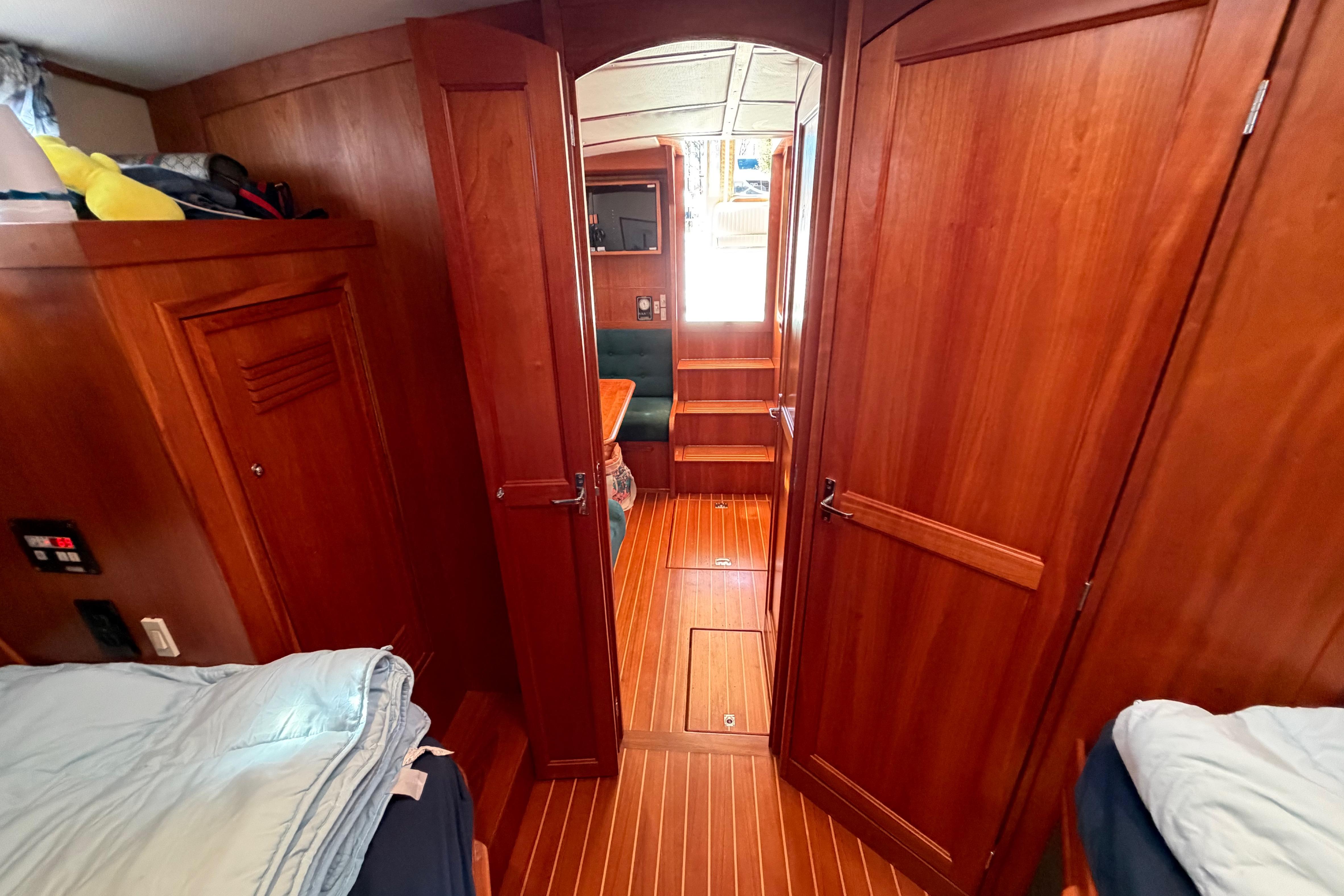 Interior of 2000 Sabreline 36 Express yacht with wooden paneling and cozy cabin layout.