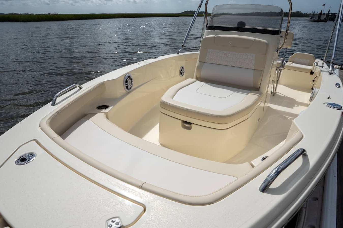 2026 Scout 188 Sportfish boat with spacious seating on calm water.