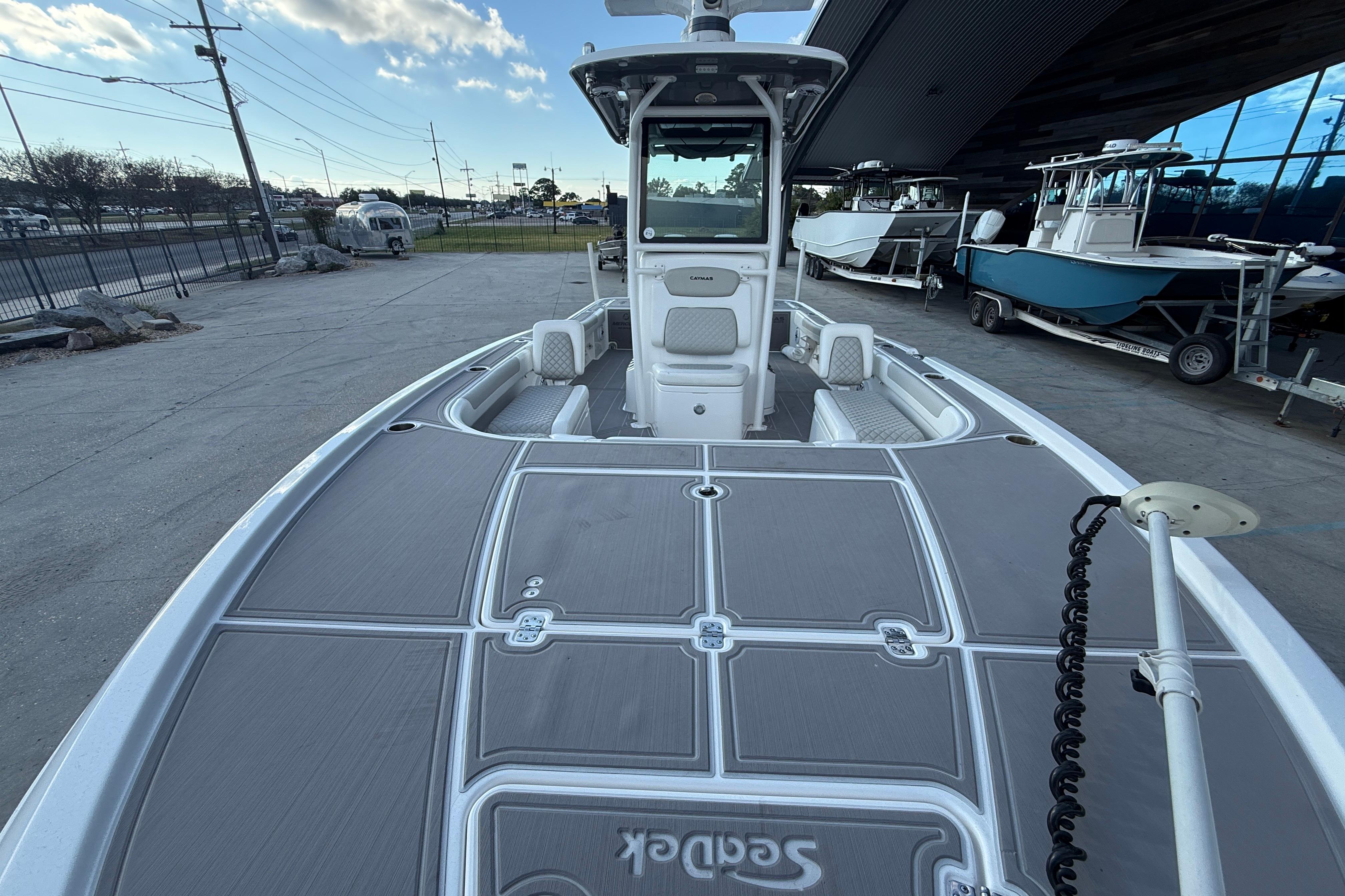 2022 Caymas 28 HB Twin boat with spacious deck and modern design.