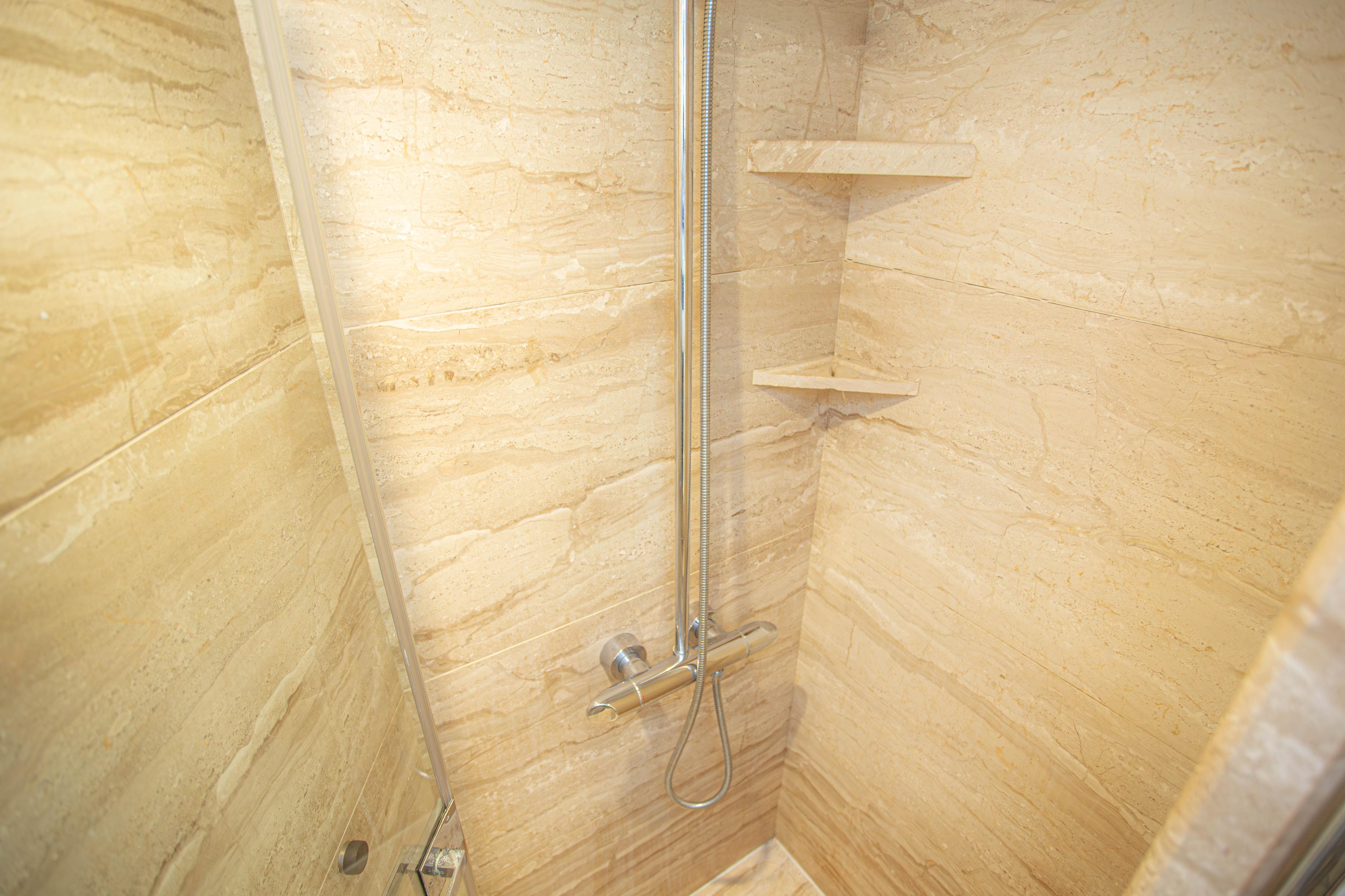 Luxurious marble shower in 2014 Fifth Ocean Yachts 24m Explorer Yacht.