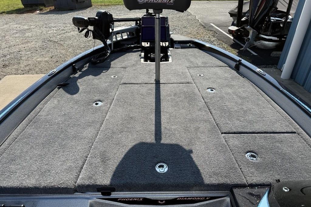 2026 Phoenix 20 XE boat deck with gray carpet and storage compartments.