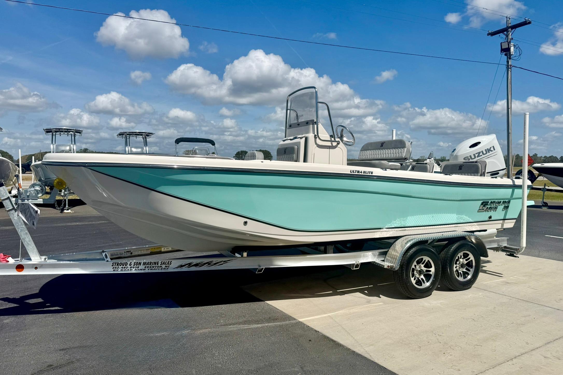 2026 Carolina Skiff 21 Ultra Elite boat on trailer under blue sky.