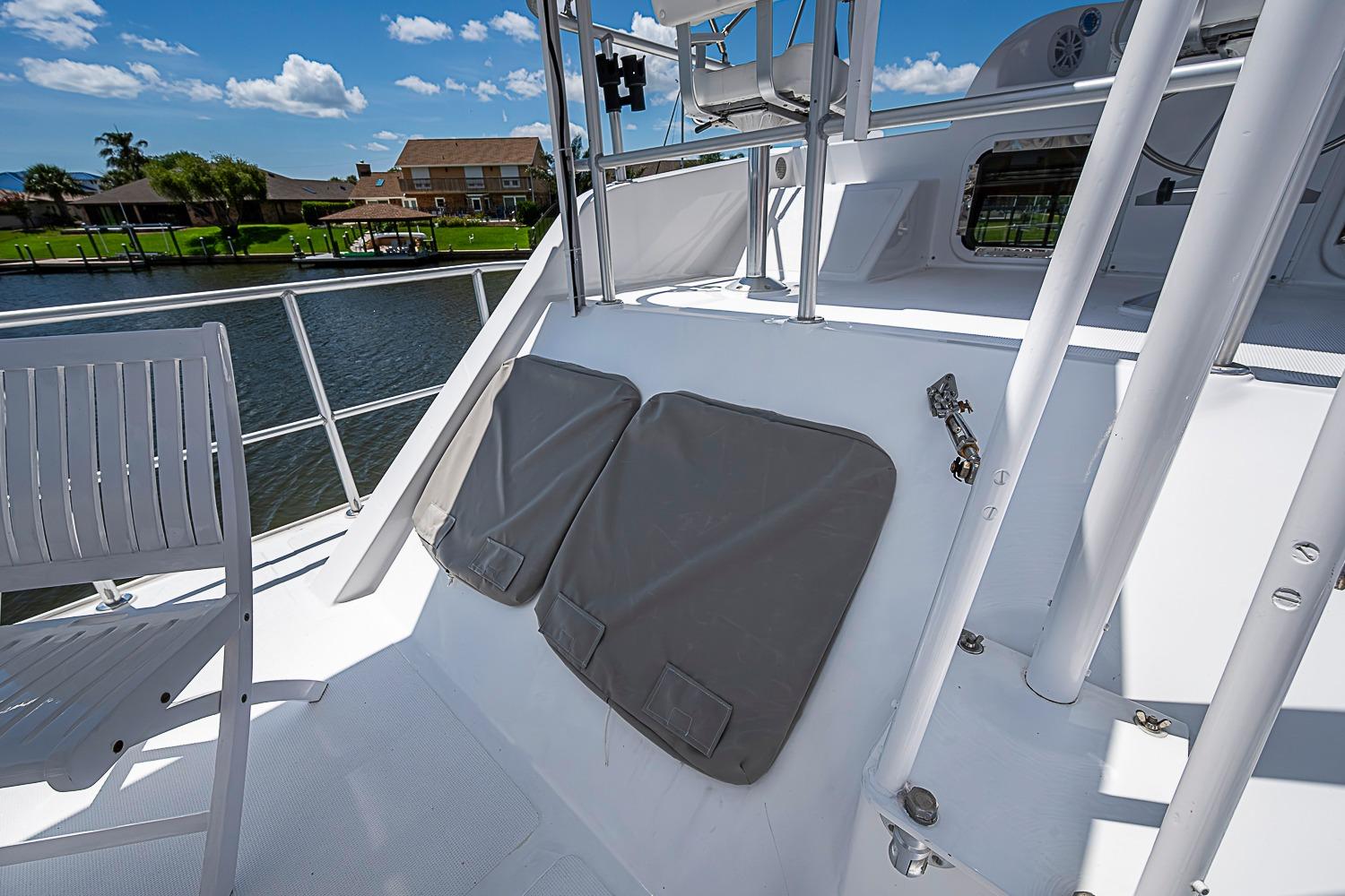 Deck view of 2003 Magna Marine Nova Scotia 47 yacht, featuring seating and railing.