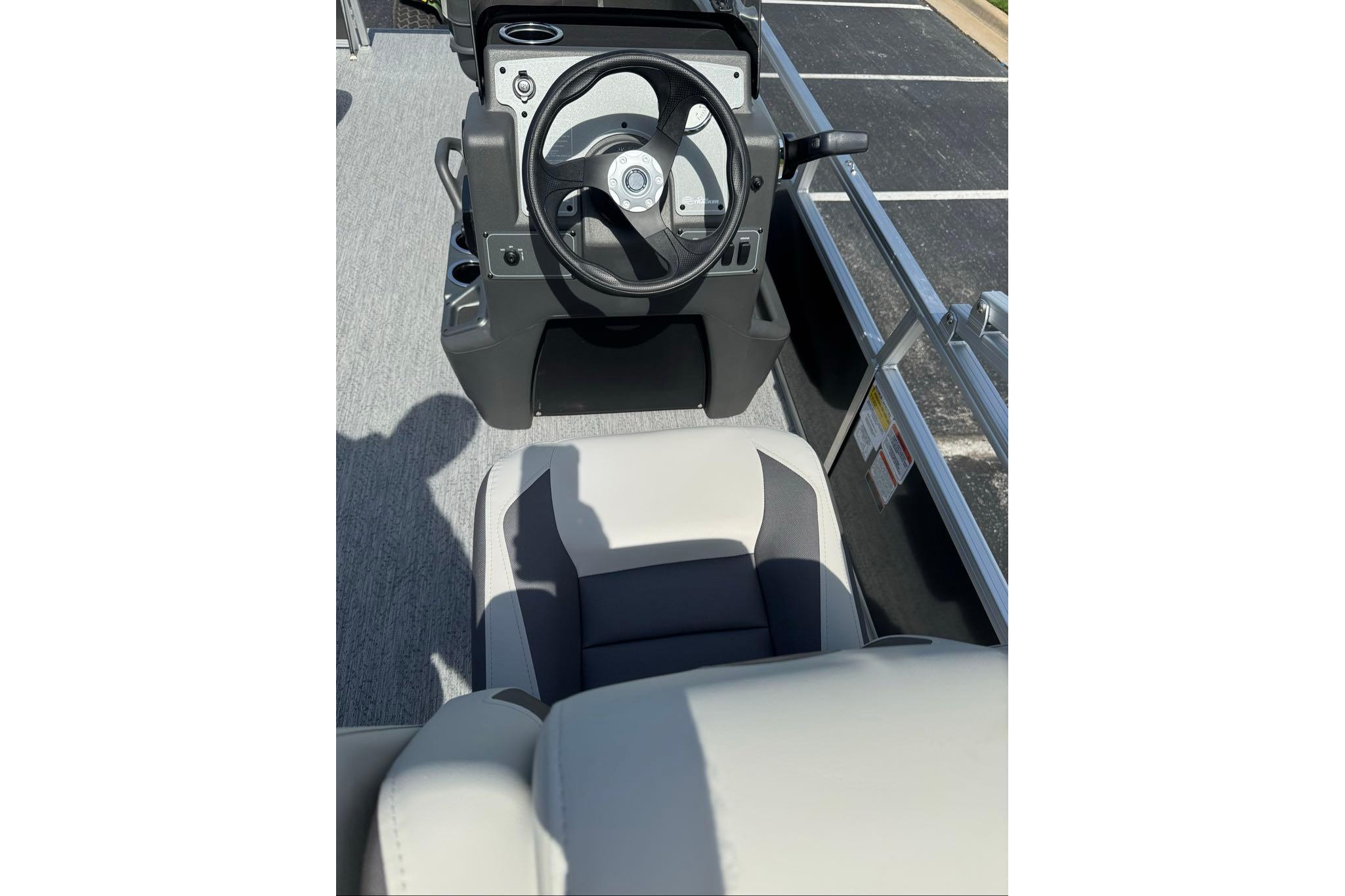 2026 Sun Tracker Bass Buggy 16 XL Select steering console and seating area.