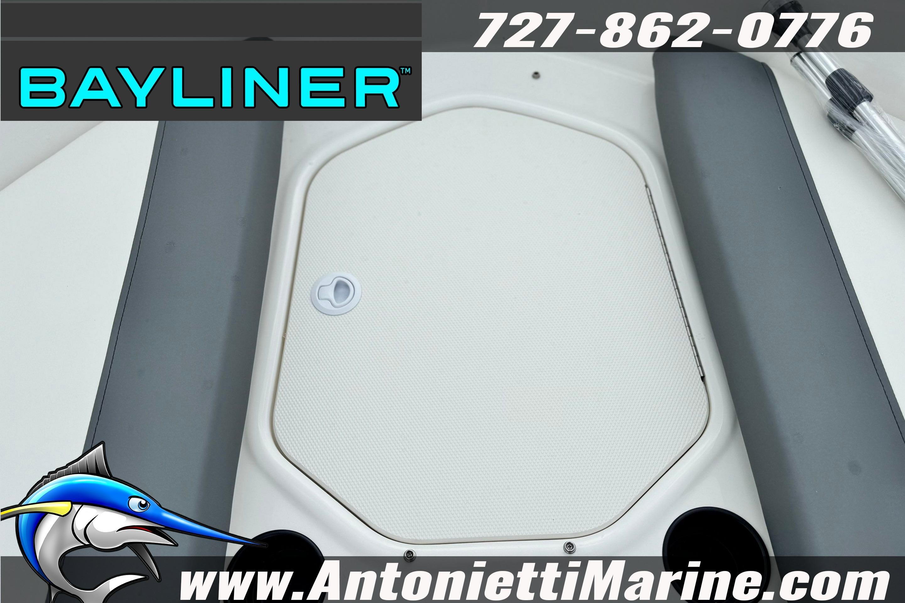 Bayliner Element E16 boat deck, 2026 model, featuring storage hatch and branding.