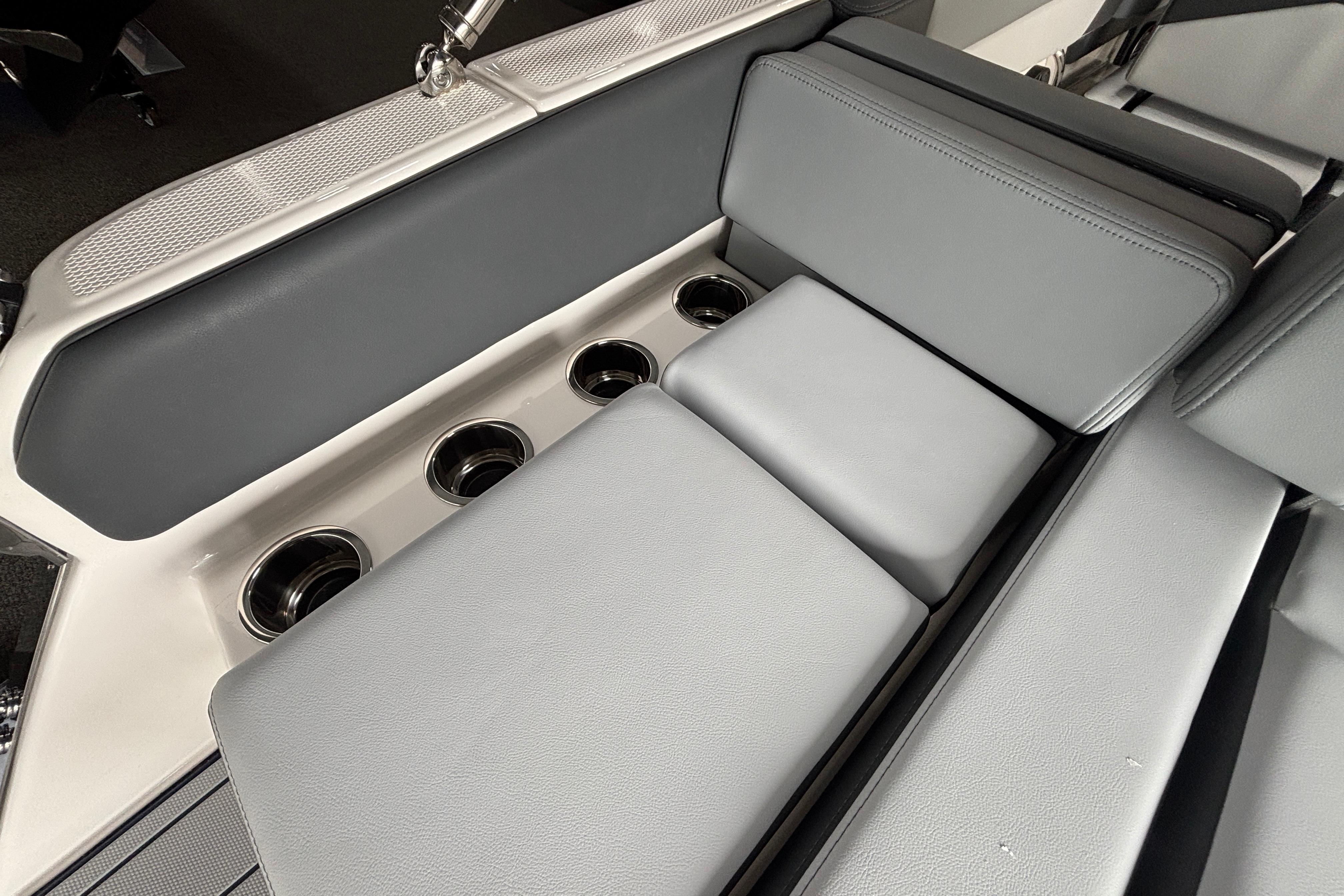 2026 Chaparral SSX 4 boat interior with gray seating and cup holders.