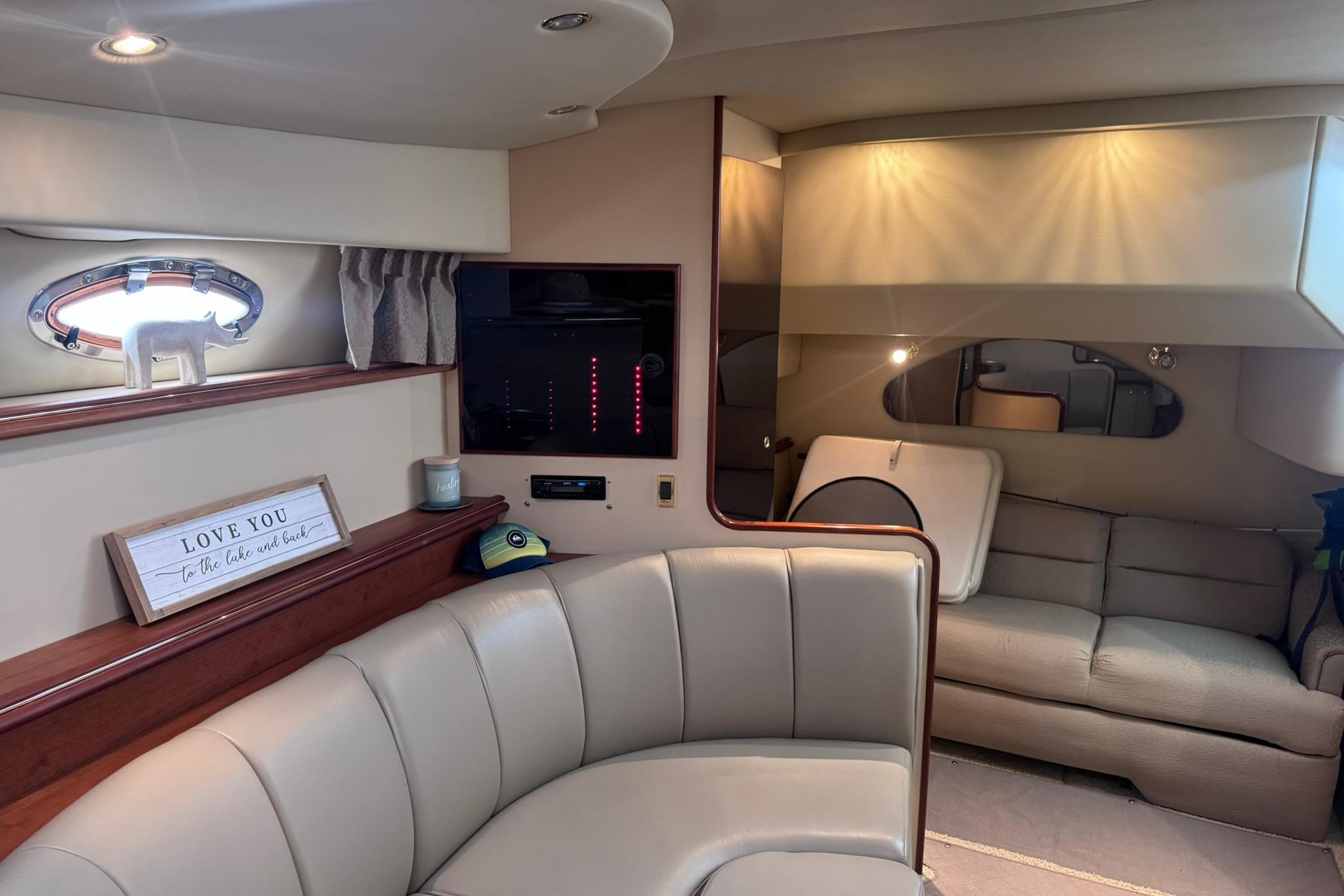 Interior of 2002 Cruisers Yachts 3275 Express with cozy seating and decor.