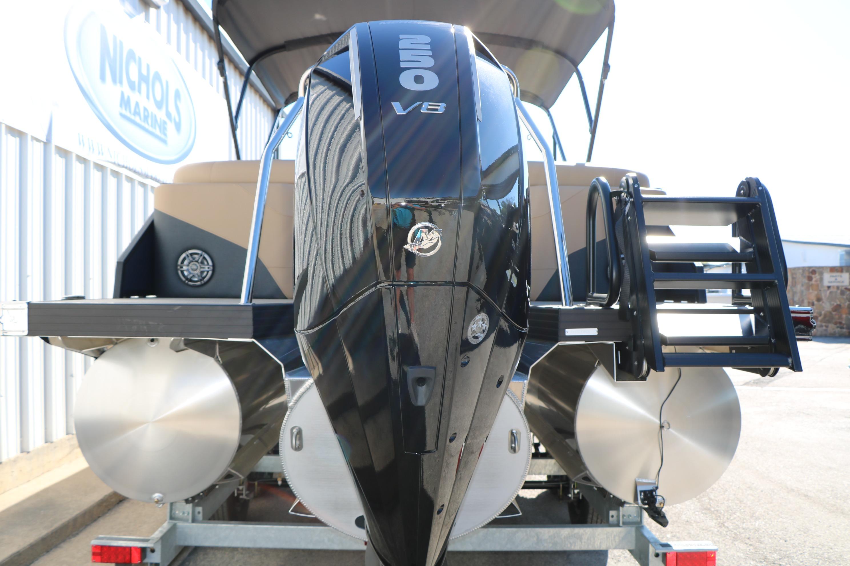2026 Evotti 525 QL Tri-Toon boat with powerful V8 engine, rear view.