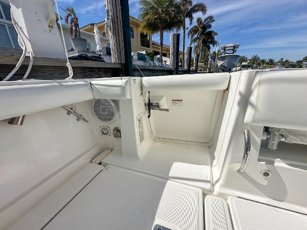 2006 Tiara Yachts 3200 Open boat interior with white seating and dockside view.