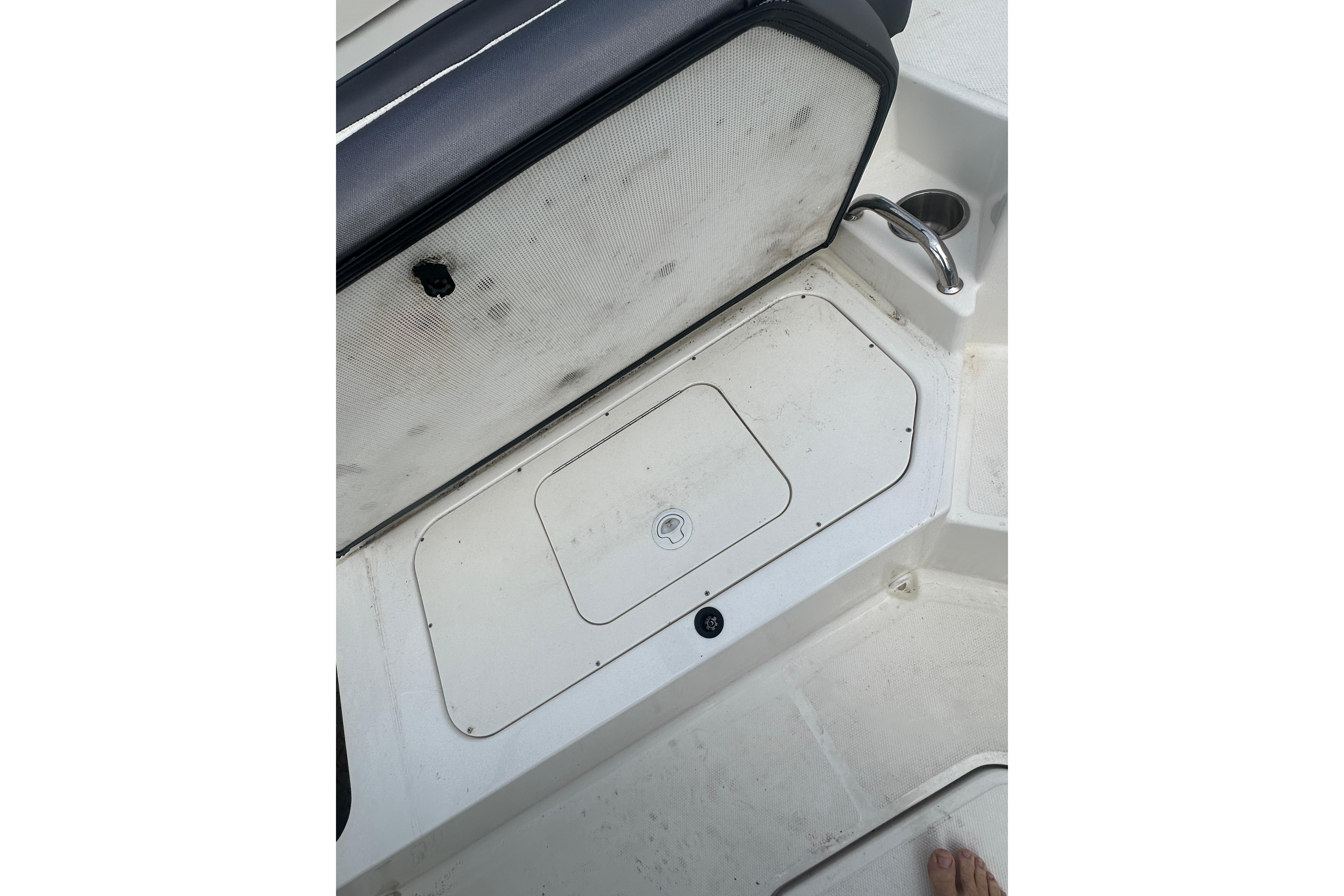 2017 Sea Ray SPX 190 Outboard boat interior with storage compartment and seating.