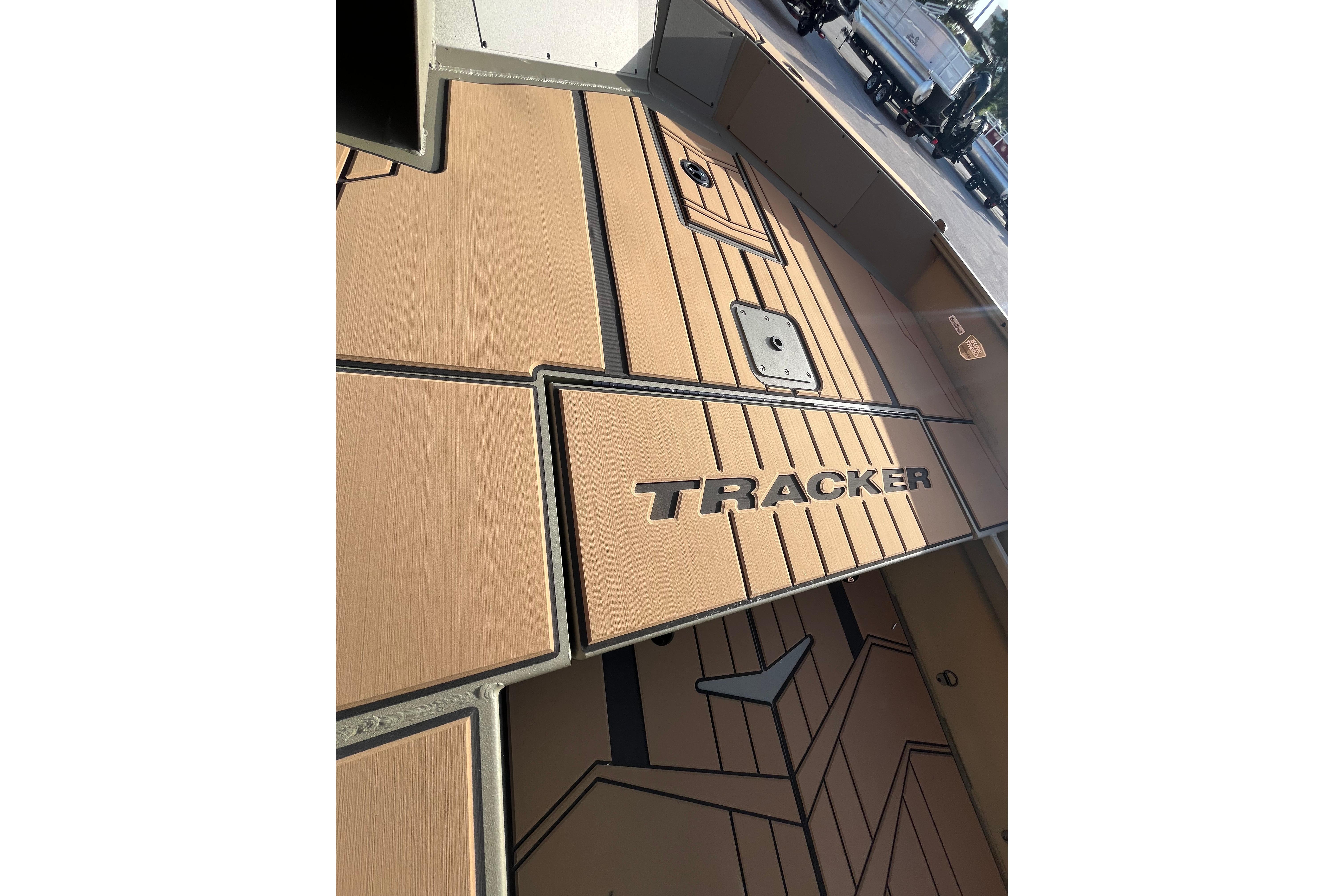 2026 Tracker Grizzly 1756 T Marsh boat interior with tan flooring and logo.