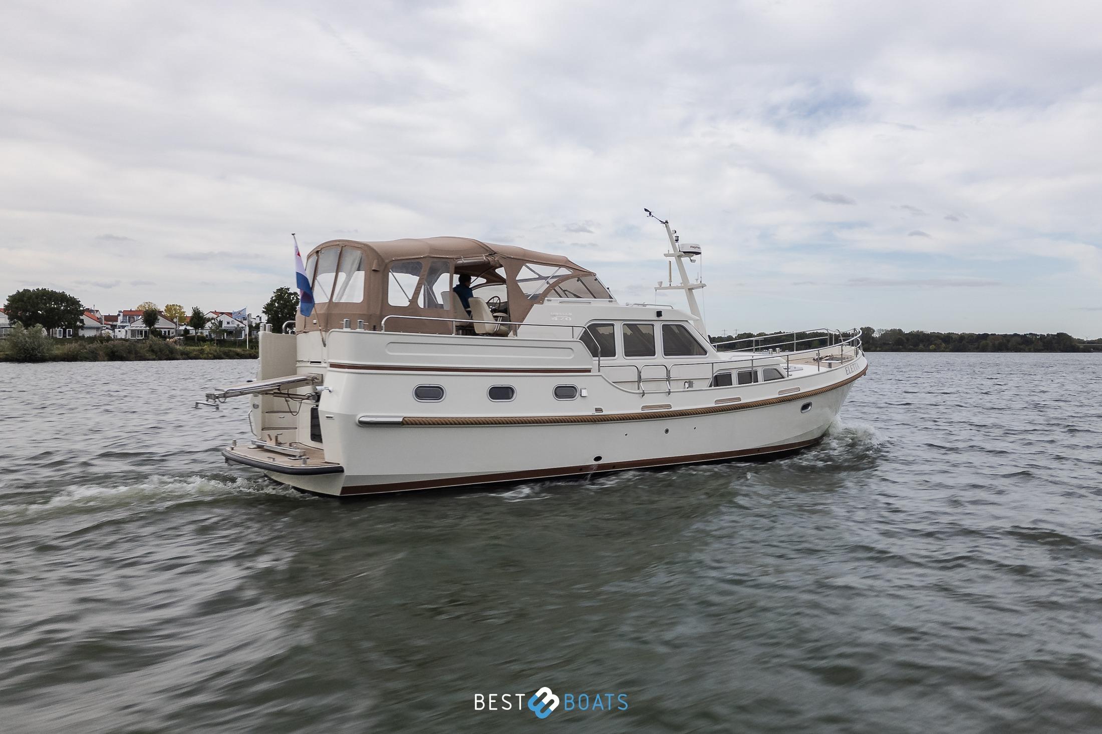 2010 Linssen Grand Sturdy 470 AC Mark II Twin yacht cruising on a calm lake.