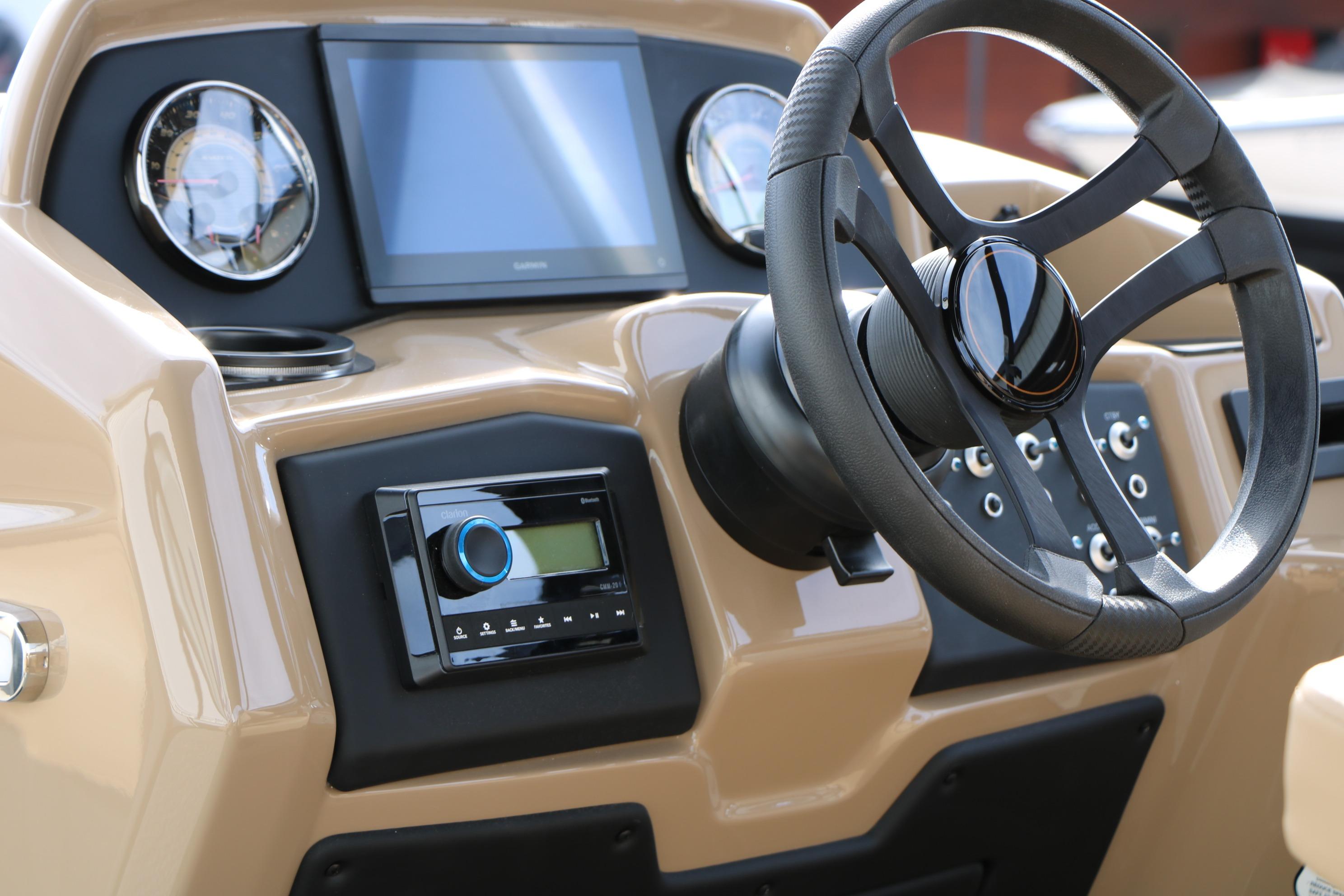 Steering console of 2026 Evotti 523CS boat with modern controls and display.