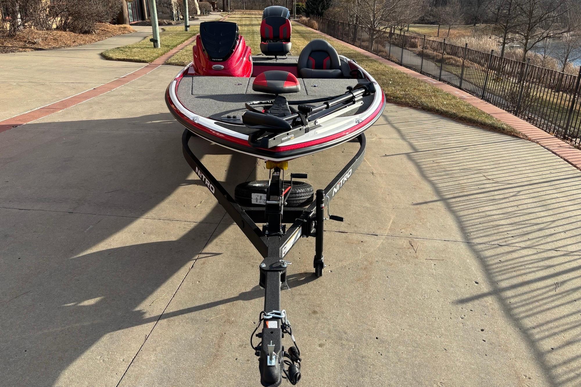 2026 Nitro Z17 boat on trailer, parked on a sunny driveway.