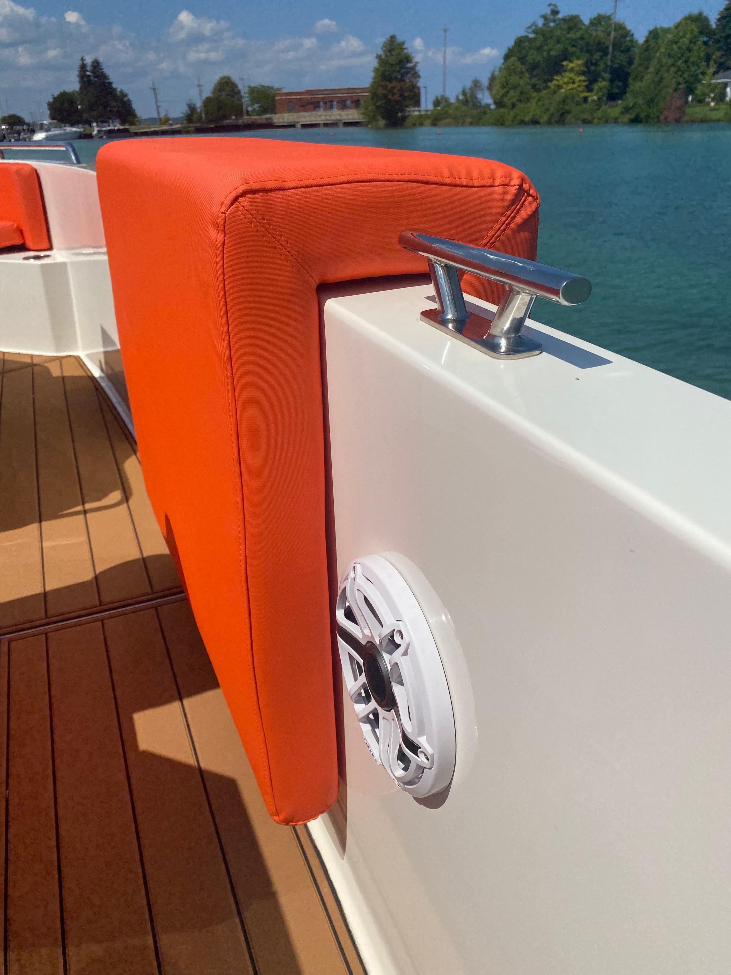 De Antonio Yachts D 28 (2020) with orange seating, dock cleat, and speaker on deck.