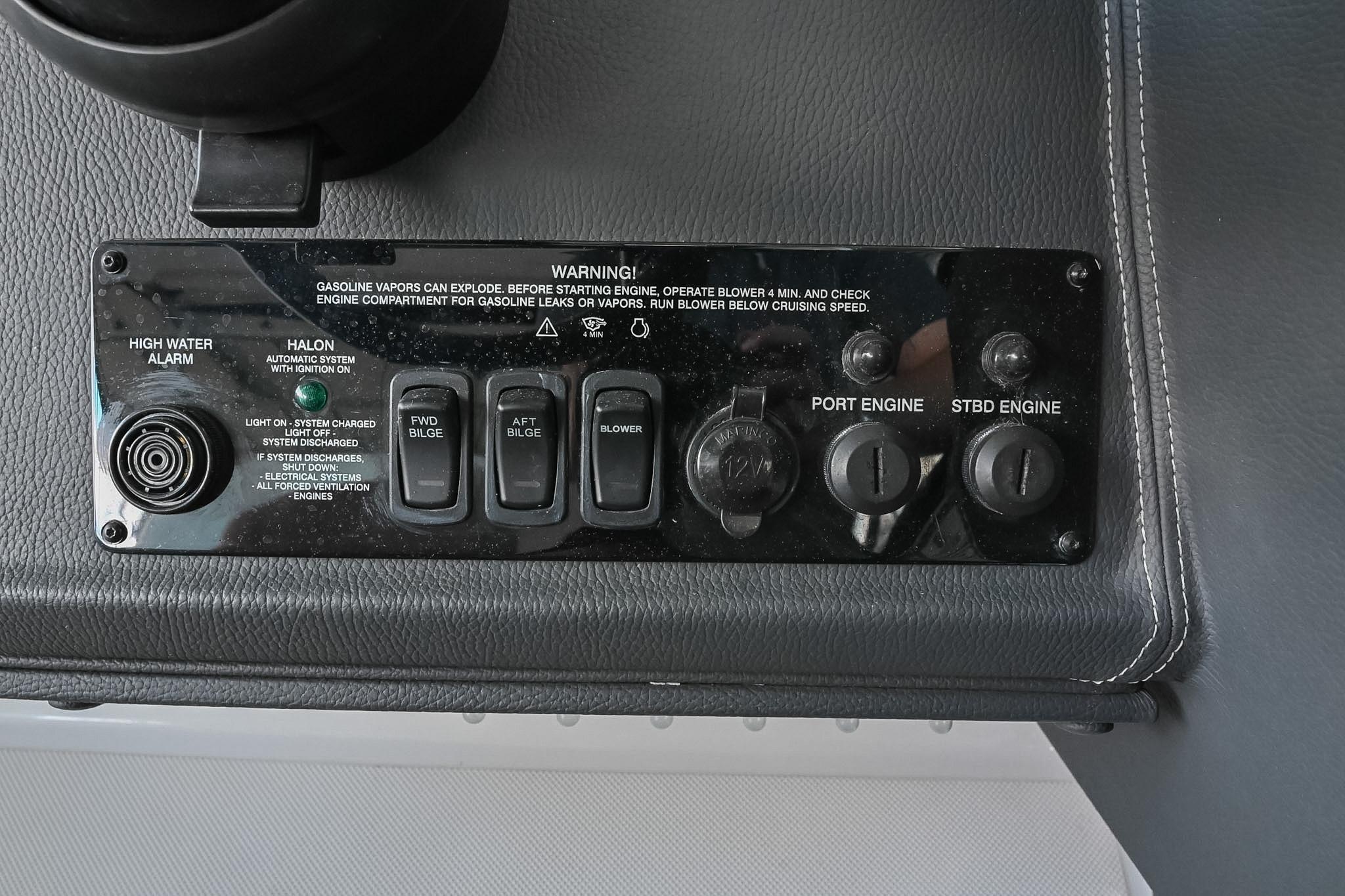 Control panel of a 2021 Regal 33 Express boat with engine and bilge switches.