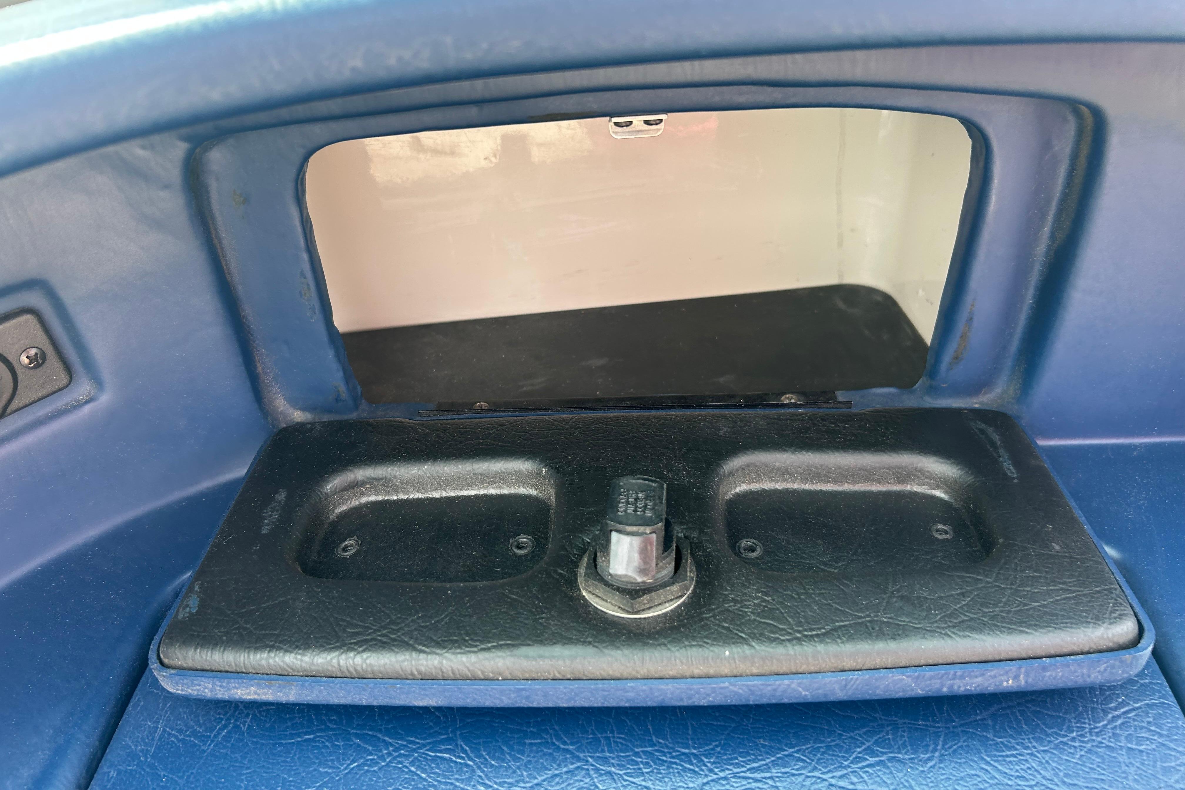 Interior compartment of a 1996 Mariah 180 Shabah boat, featuring a storage area.
