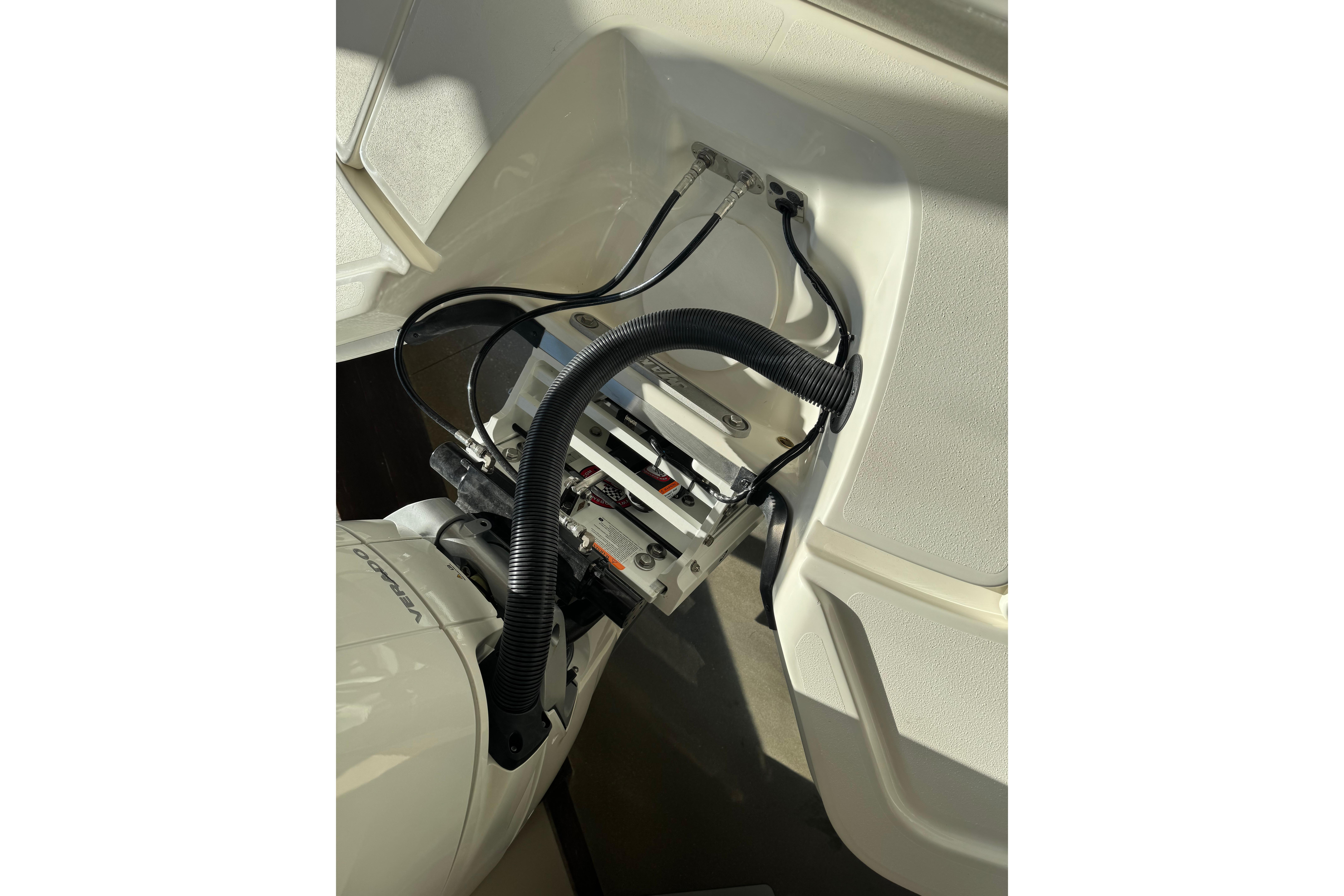 2026 Mako 24 APEX boat engine compartment with wiring and components.