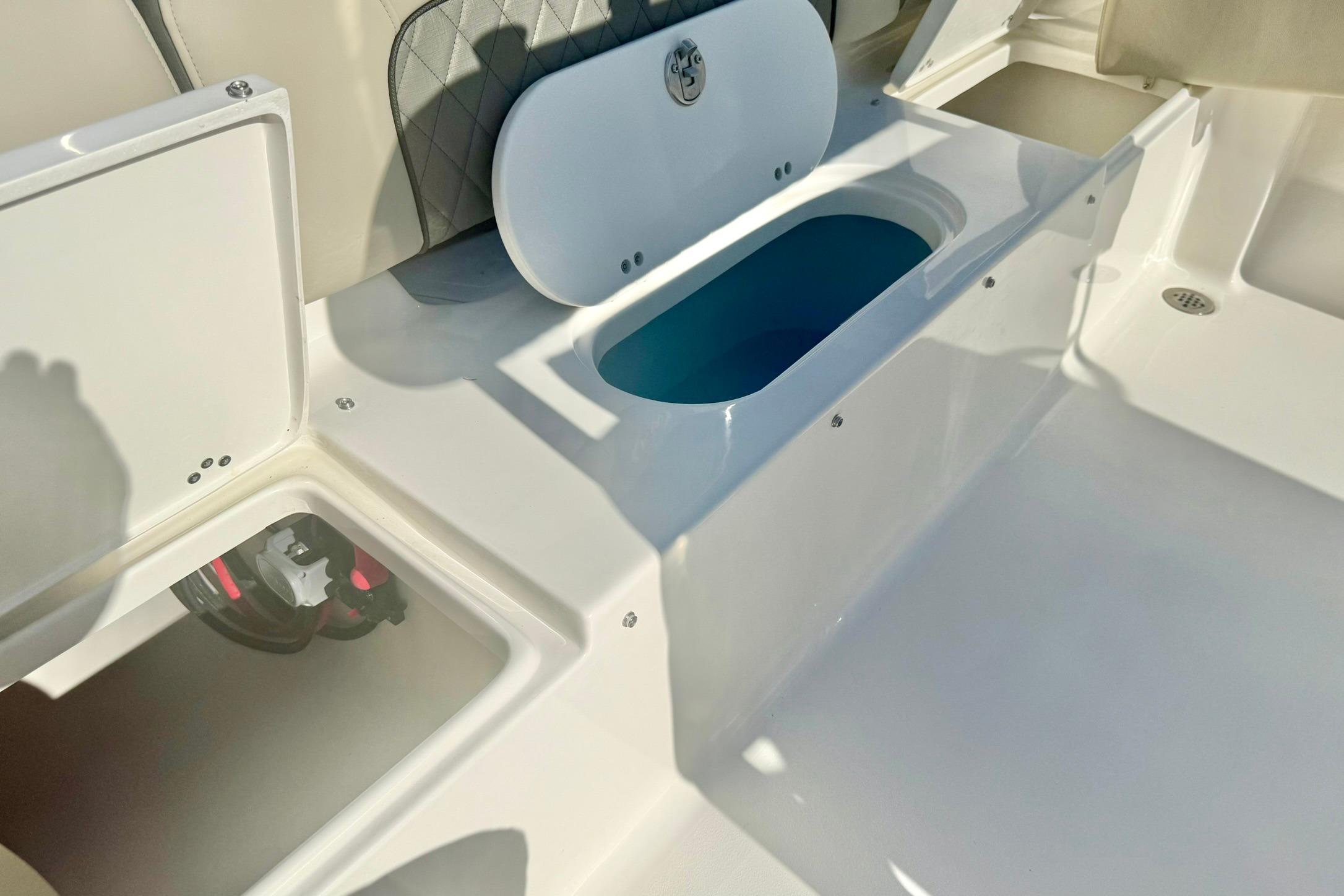 2026 Key West 189 FS boat interior with storage compartments and seating.