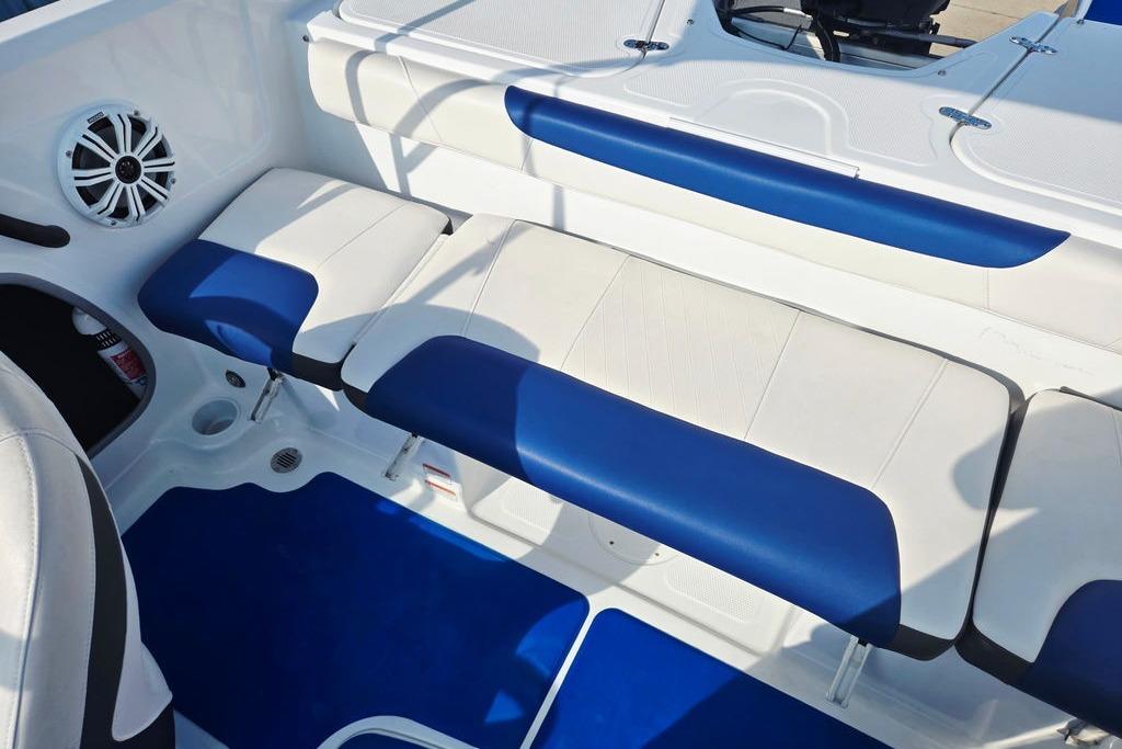 Interior of a 2018 Tahoe 450 TS boat with blue and white seating.