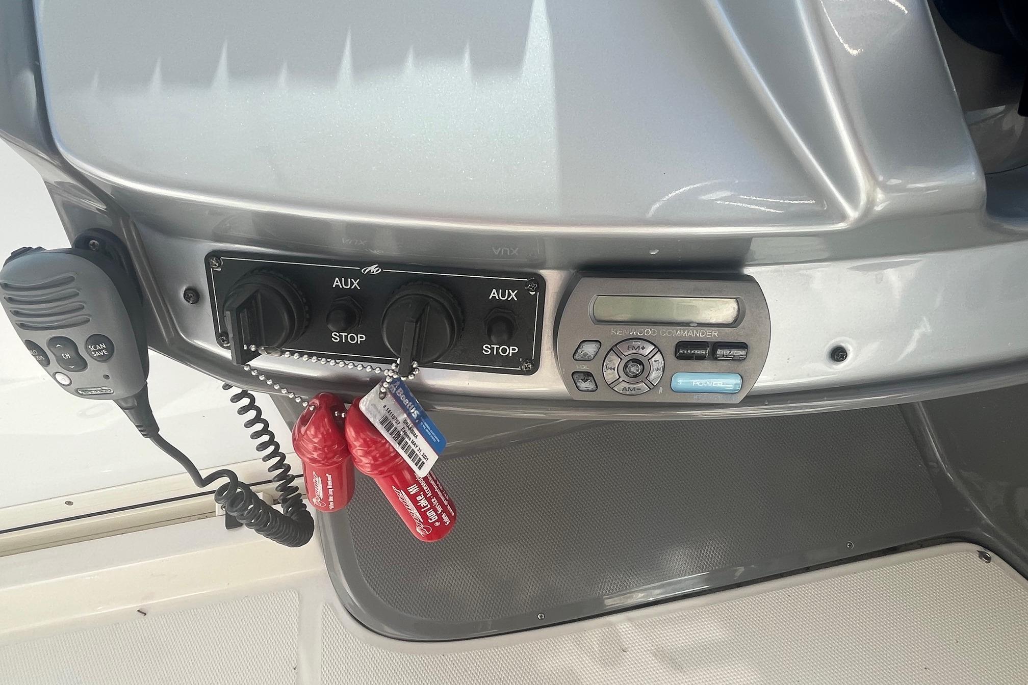 Control panel of a 2010 Monterey 400 Sport Yacht with radio and auxiliary switches.