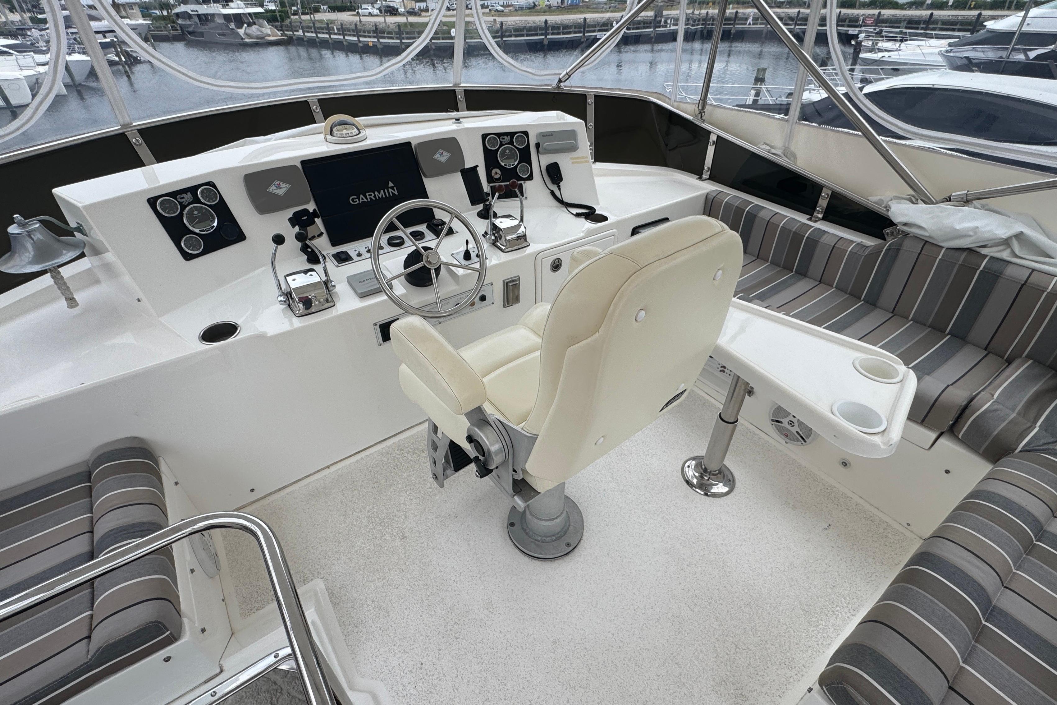 Pilothouse interior of 2007 Jefferson Pilothouse 52 SE with helm, seating, and navigation equipment.