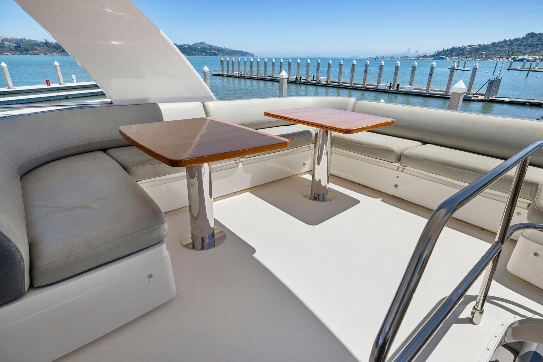 Flybridge seating area on 2015 Princess 60 Motor Yacht with ocean view.