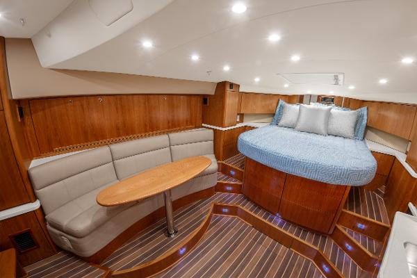Luxurious interior of 2025 Albemarle 36 Express yacht with cozy seating and elegant wood finishes.