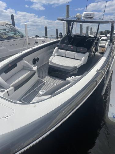 2017 Mystic Powerboats M4200 luxury speedboat docked at marina.