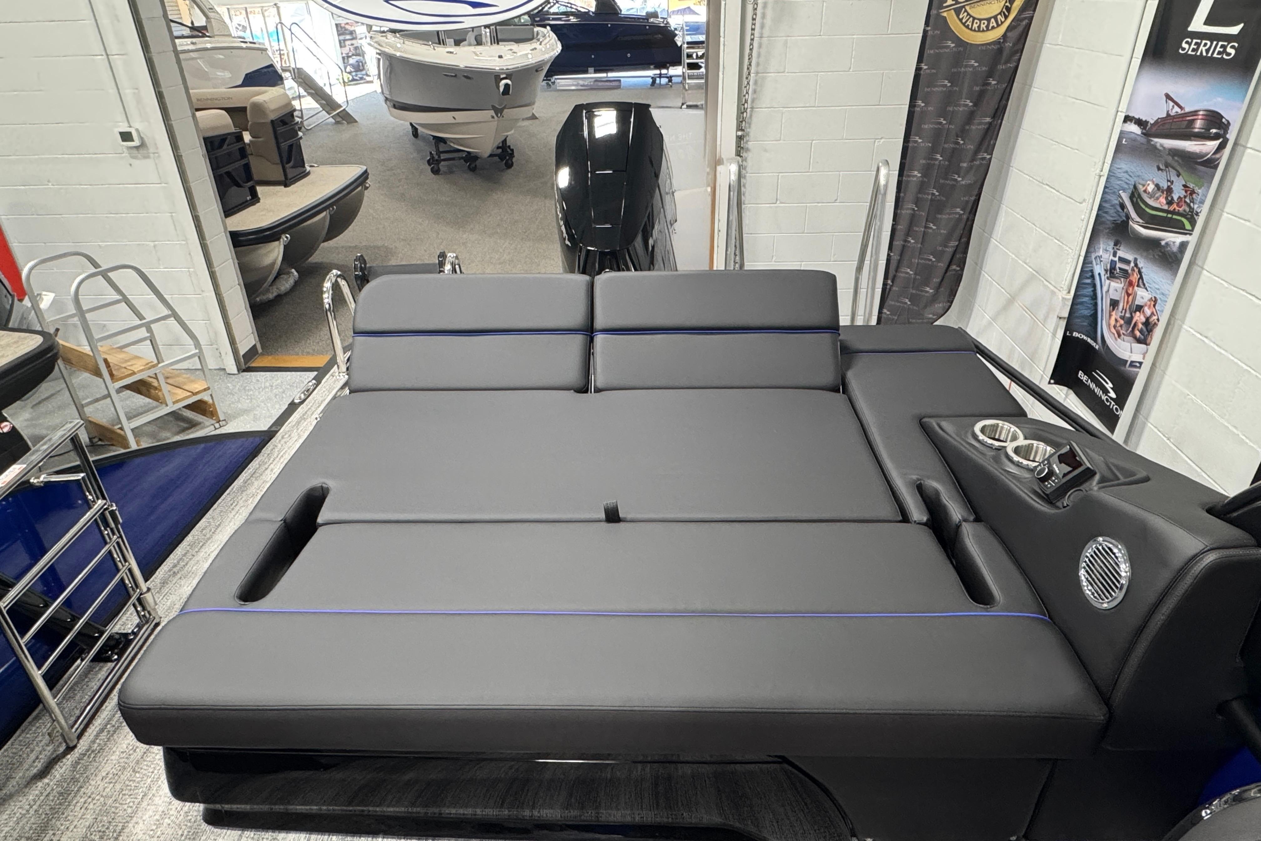 2026 Bennington 25 QSBWASE boat interior with luxurious seating and cup holders.