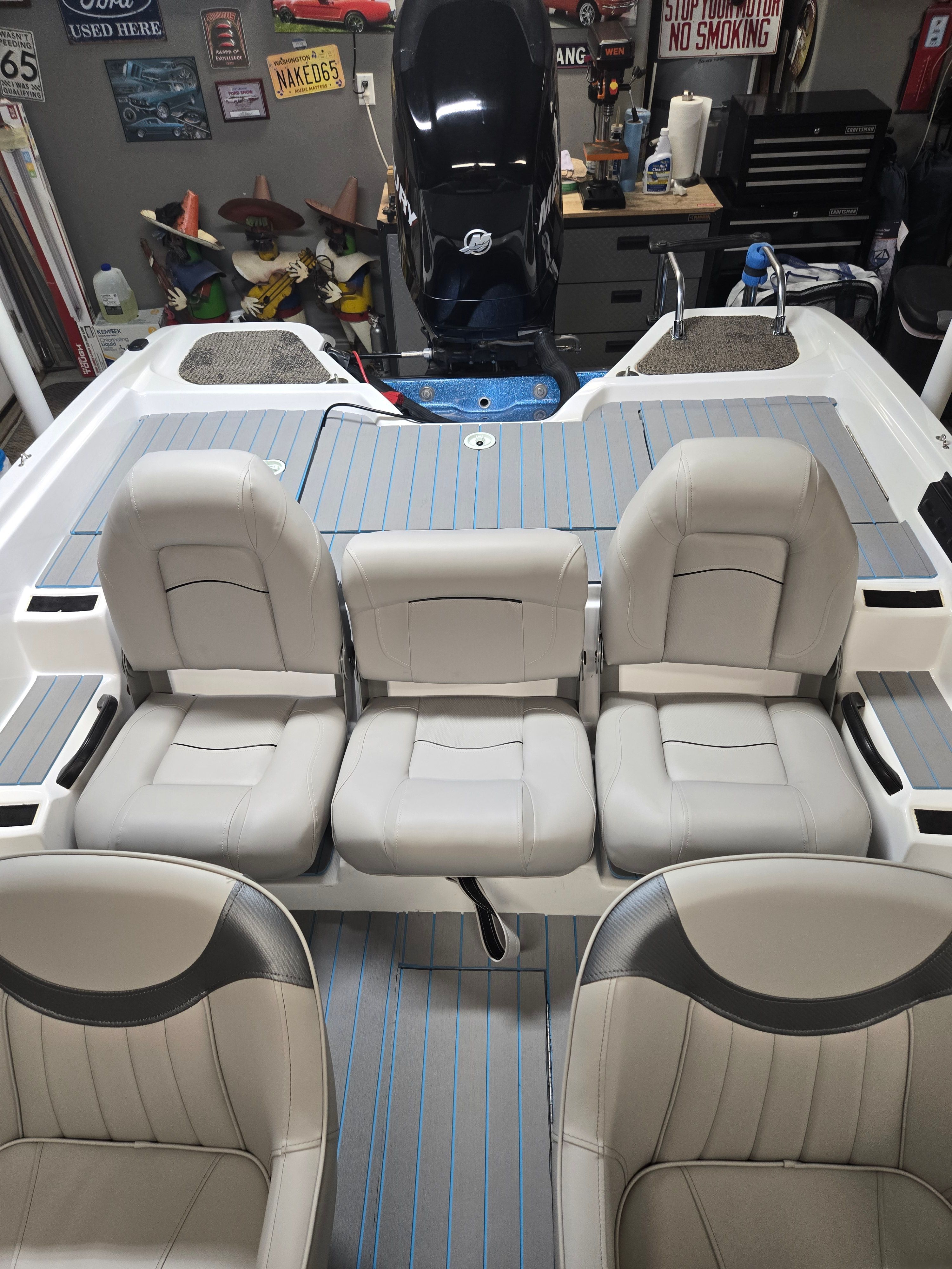 Interior view of a 2007 ProCraft 170 Combo with gray seats and blue accents.
