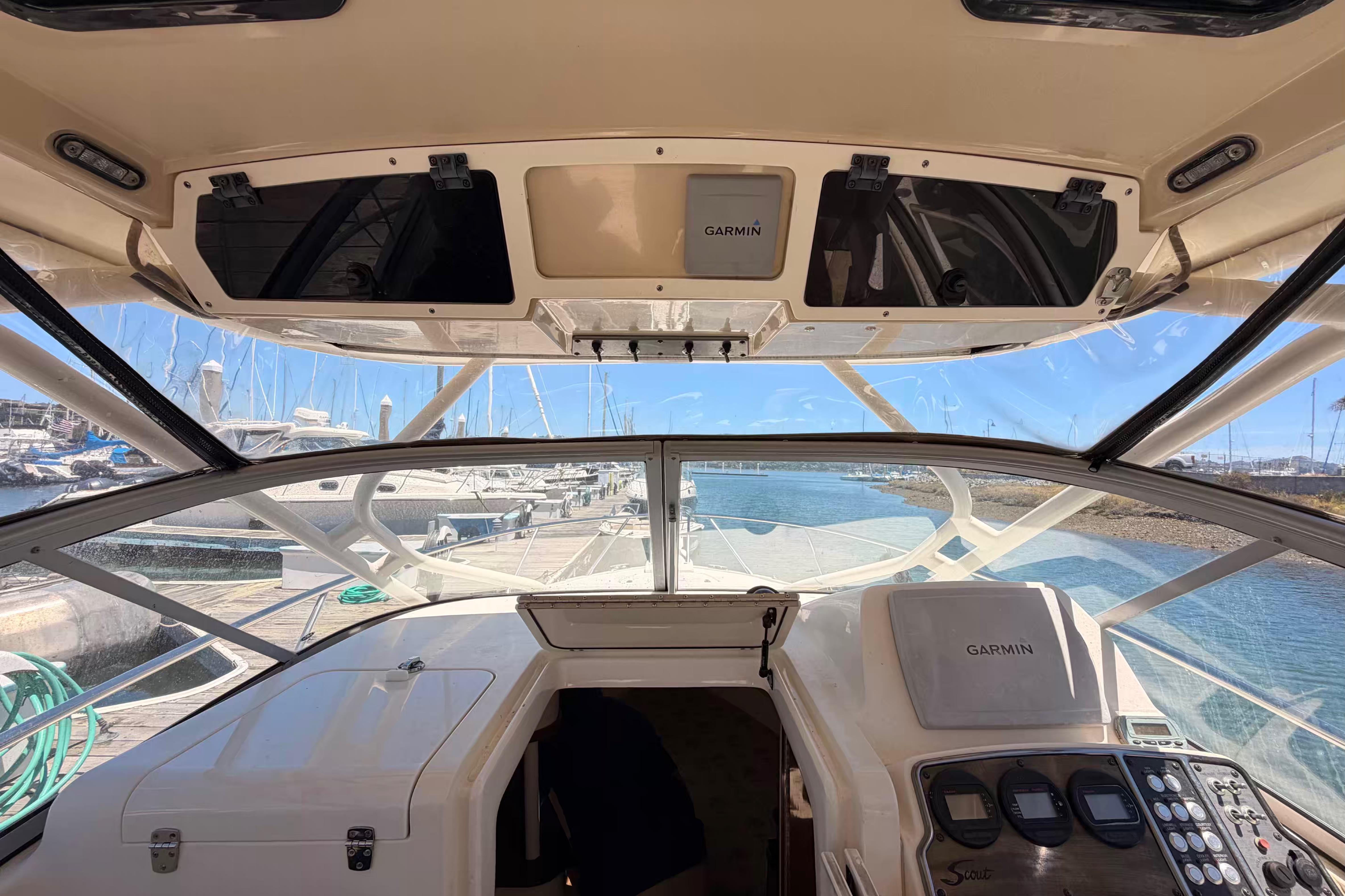 Cockpit view of 2007 Scout 262 Abaco boat with Garmin navigation system at marina.