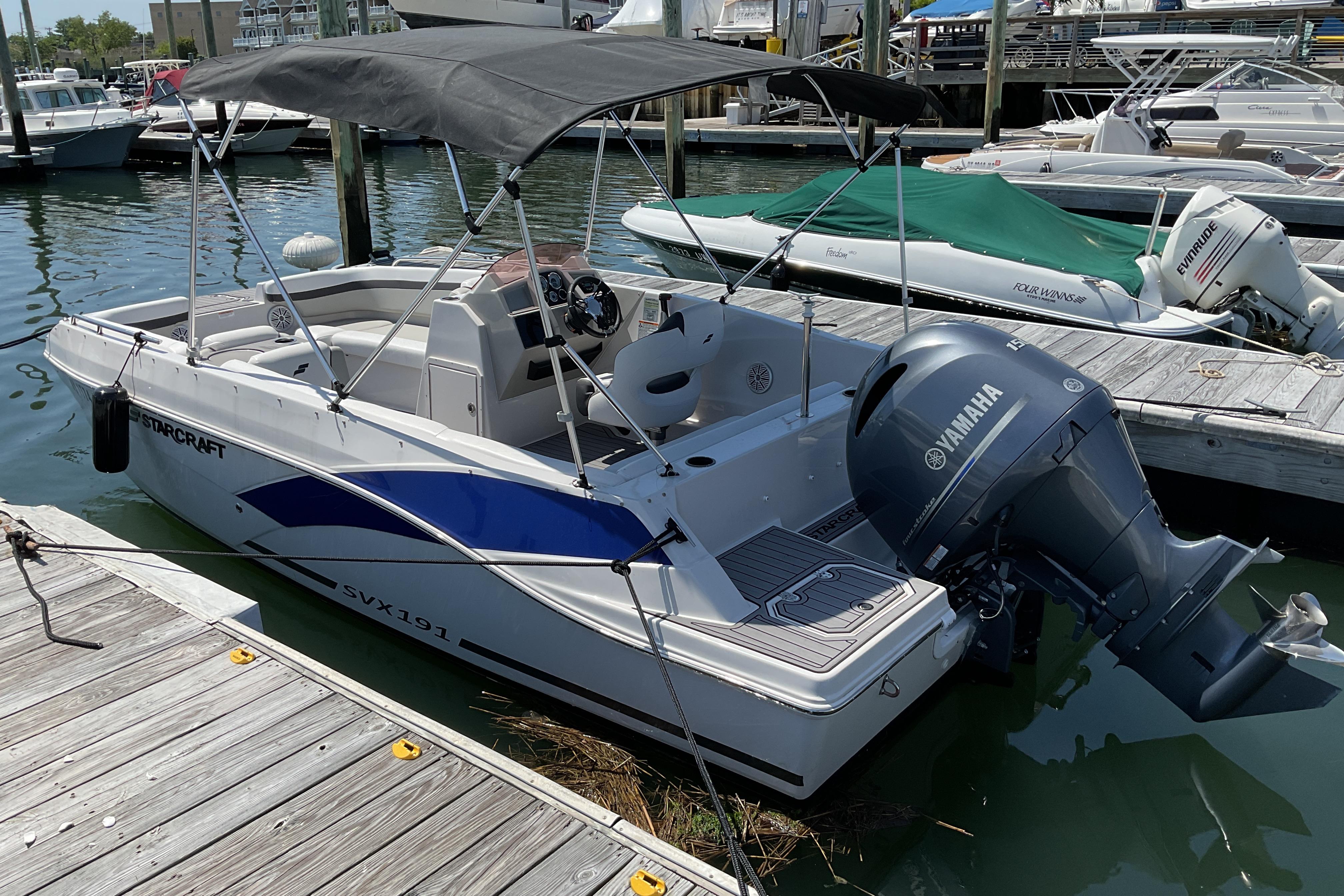 2023 Starcraft SVX 191 OB boat docked with Yamaha outboard motor.