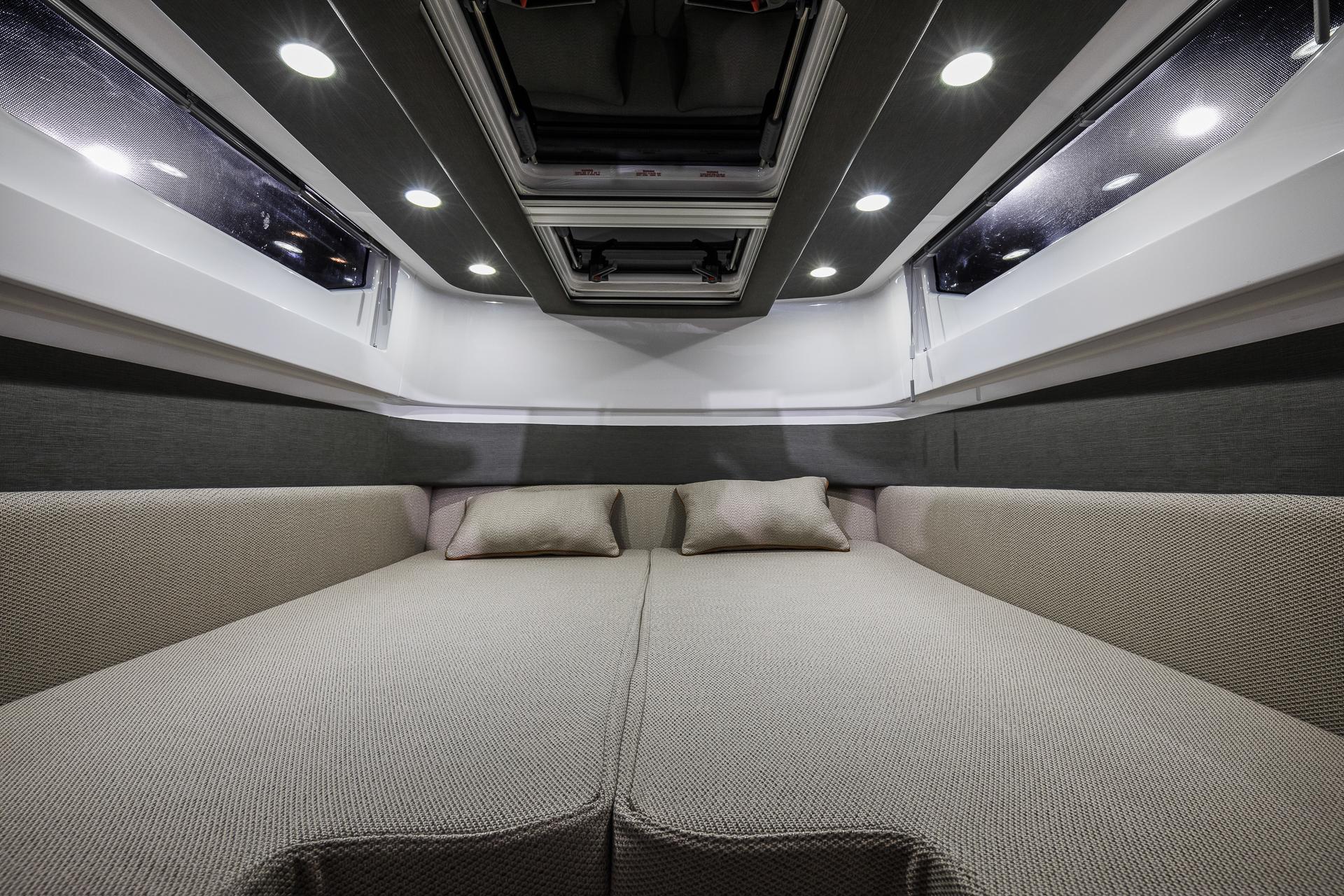 Luxurious interior of 2024 Axopar 37 XC Cross Cabin Aft Cabin with cozy bedding.