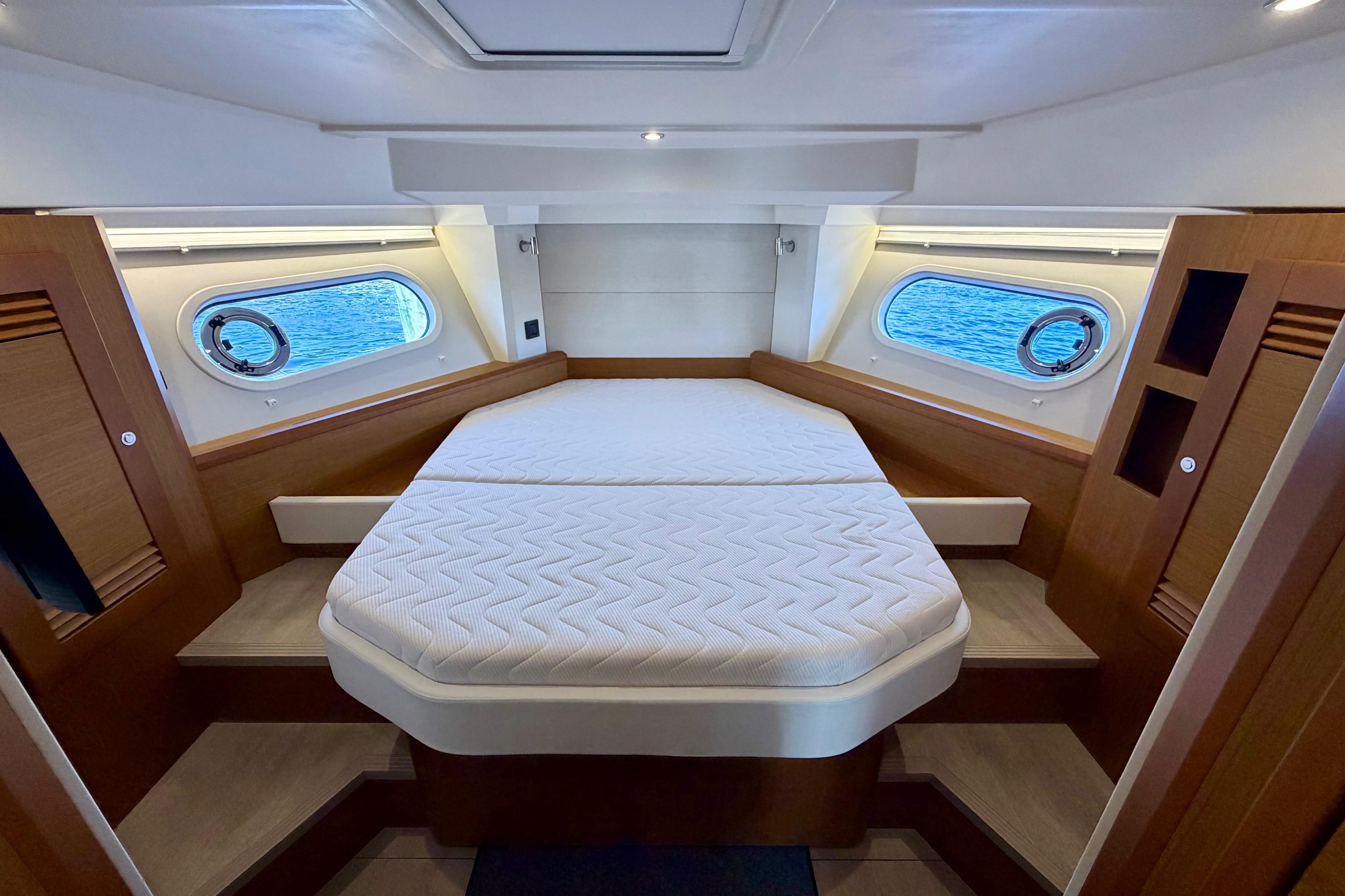 Luxurious cabin interior of 2025 Beneteau Swift Trawler 41 Fly with ocean view windows.