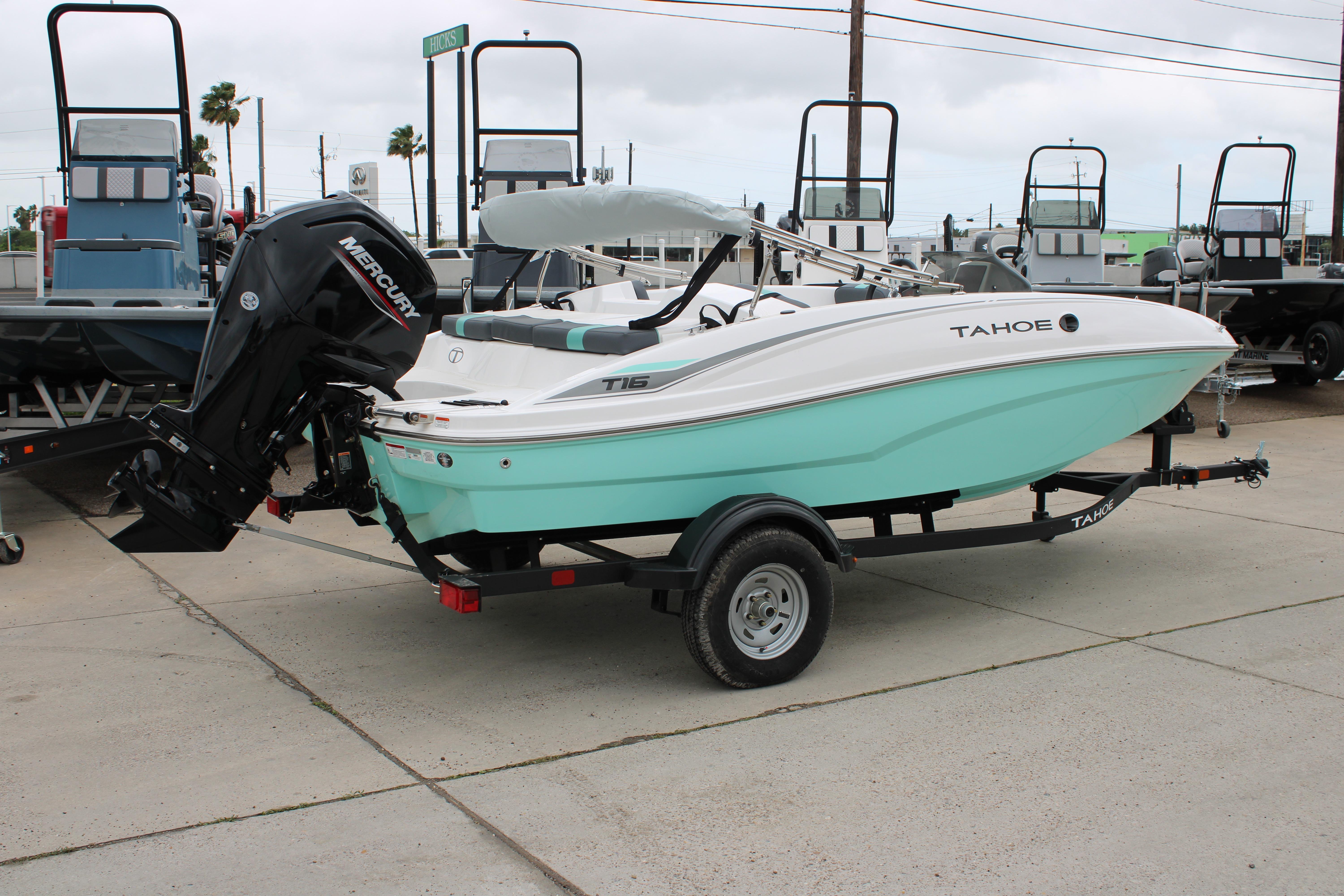 2026 Tahoe T16 boat with Mercury engine on trailer, displayed outdoors.