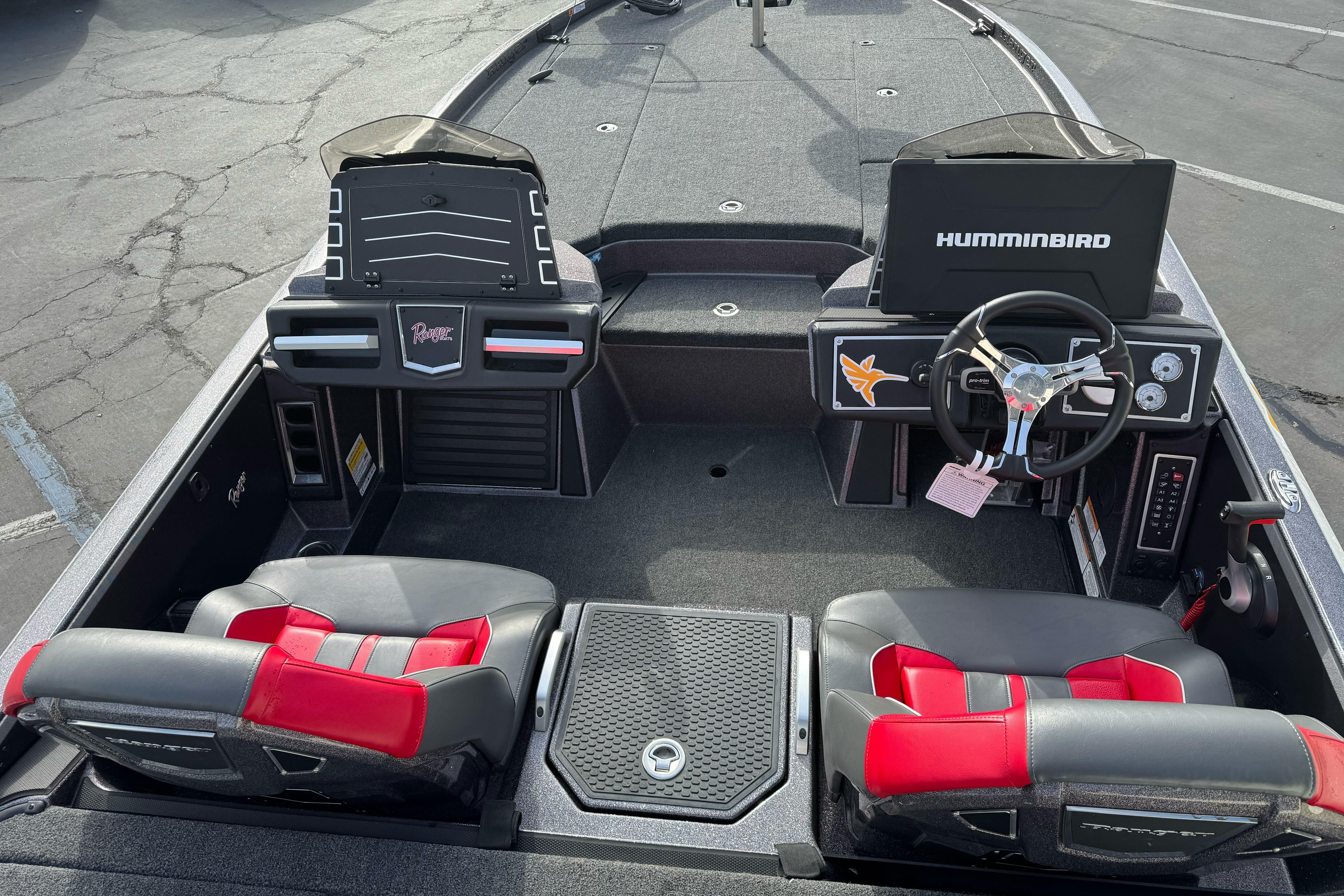 2025 Ranger Z521 boat interior with dual seats, steering wheel, and Humminbird electronics.