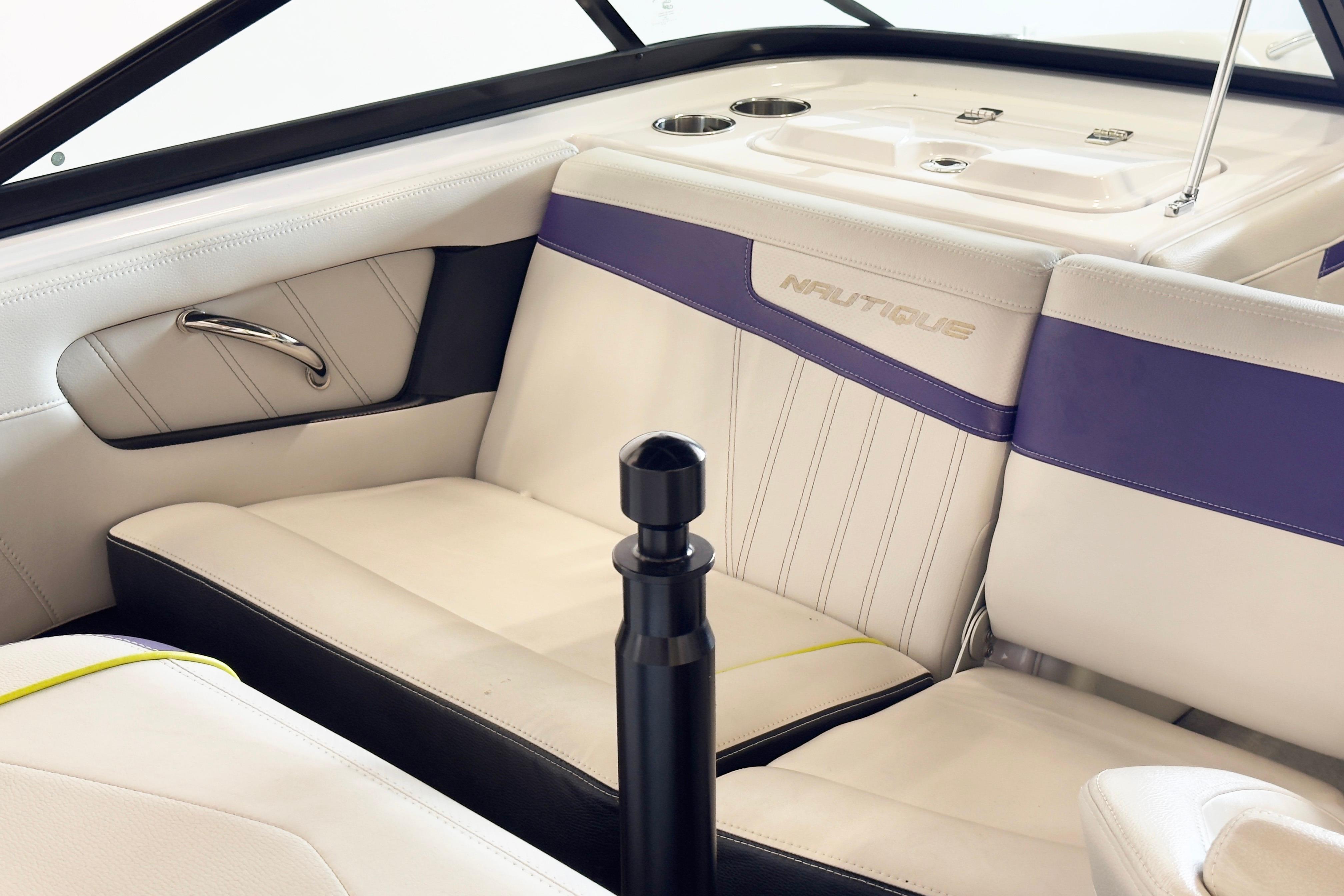 2014 Nautique Ski Nautique 200 interior with white and purple seating, sleek design.