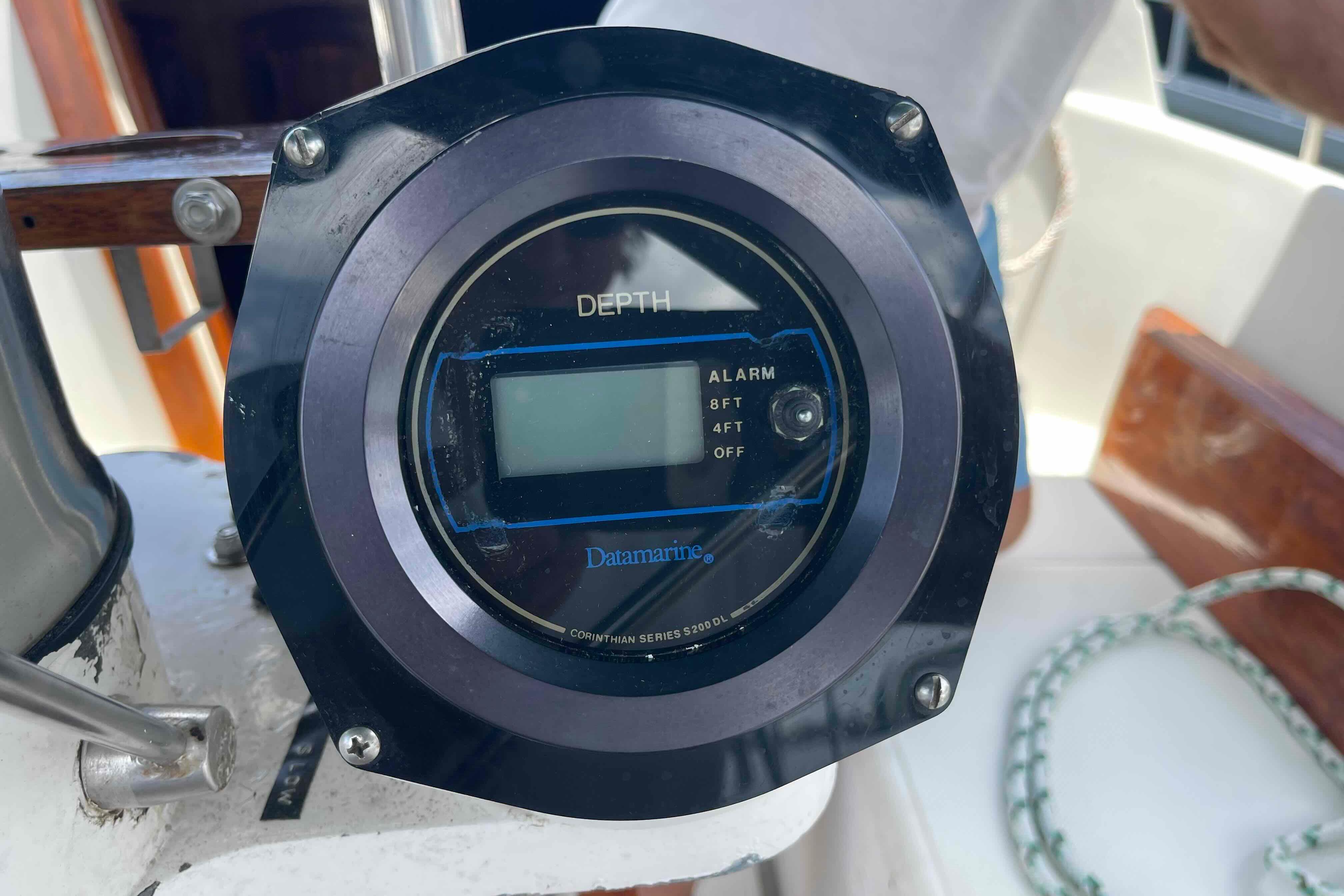 Depth gauge on a 1987 Pacific Seacraft 34 sailboat, displaying alarm settings.