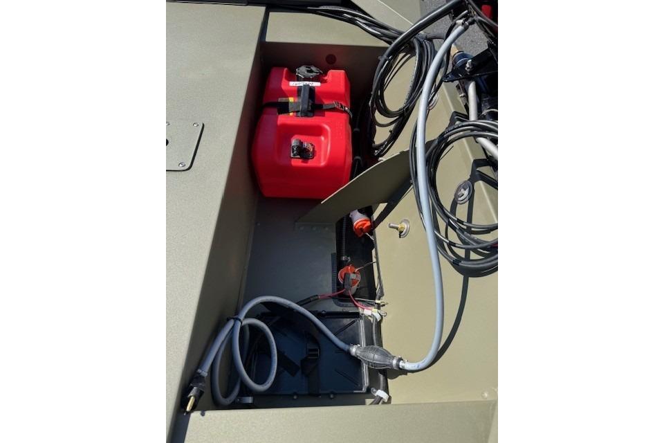 2026 Tracker Grizzly 1648 SC boat interior with red fuel tank and wiring.