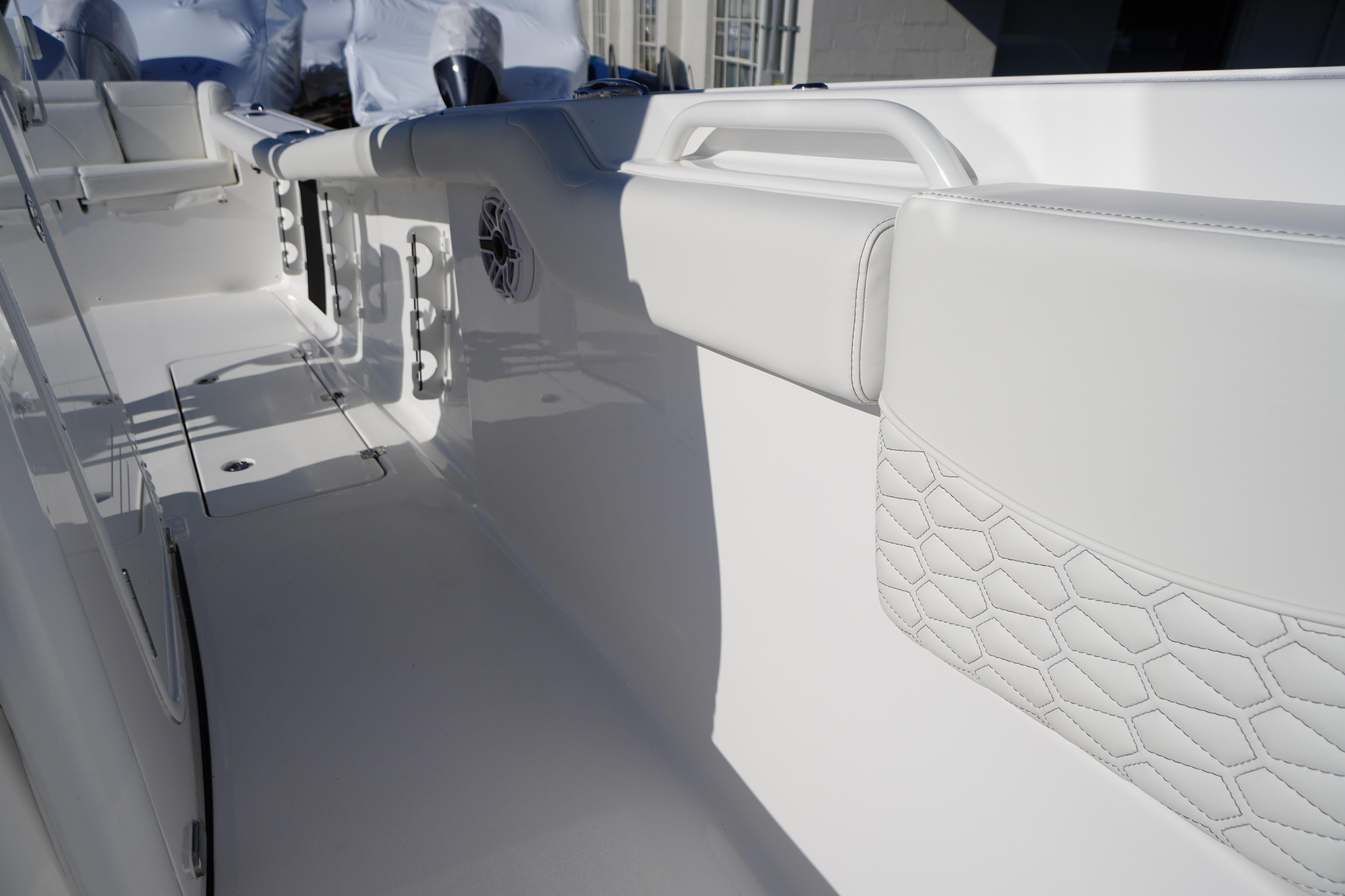 2026 Tidewater 272 LXF boat interior with white seating and sleek design.