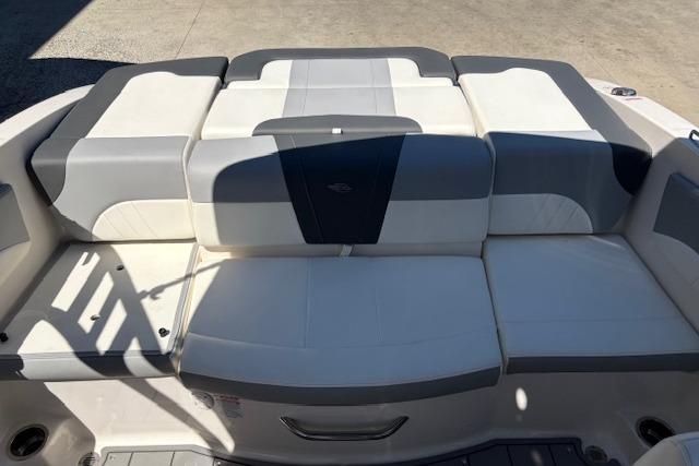 2023 Chaparral 21 SSi boat seating area with gray and white upholstery.