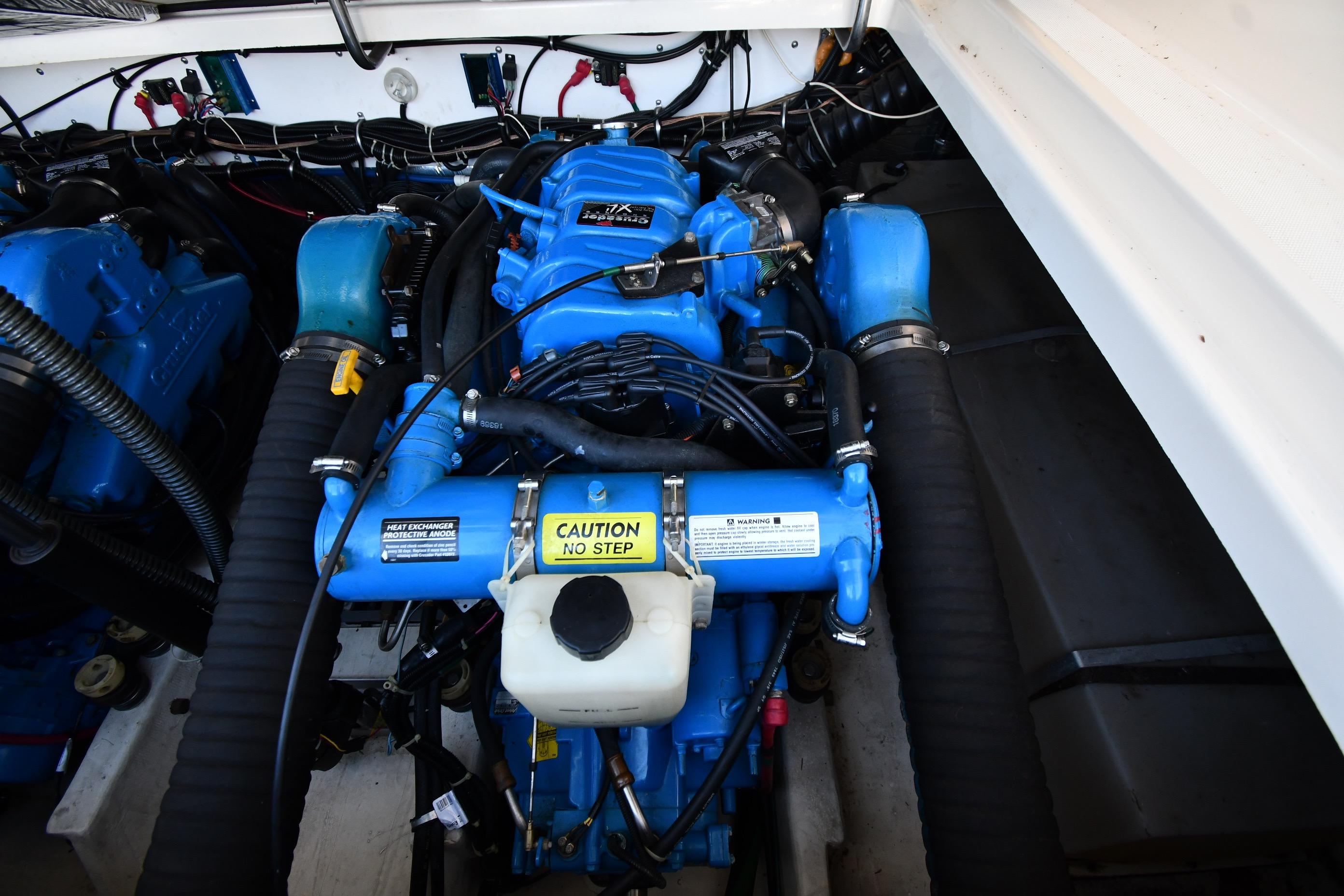 Engine compartment of a 1998 Tiara Yachts 3100 Open, featuring a blue engine.