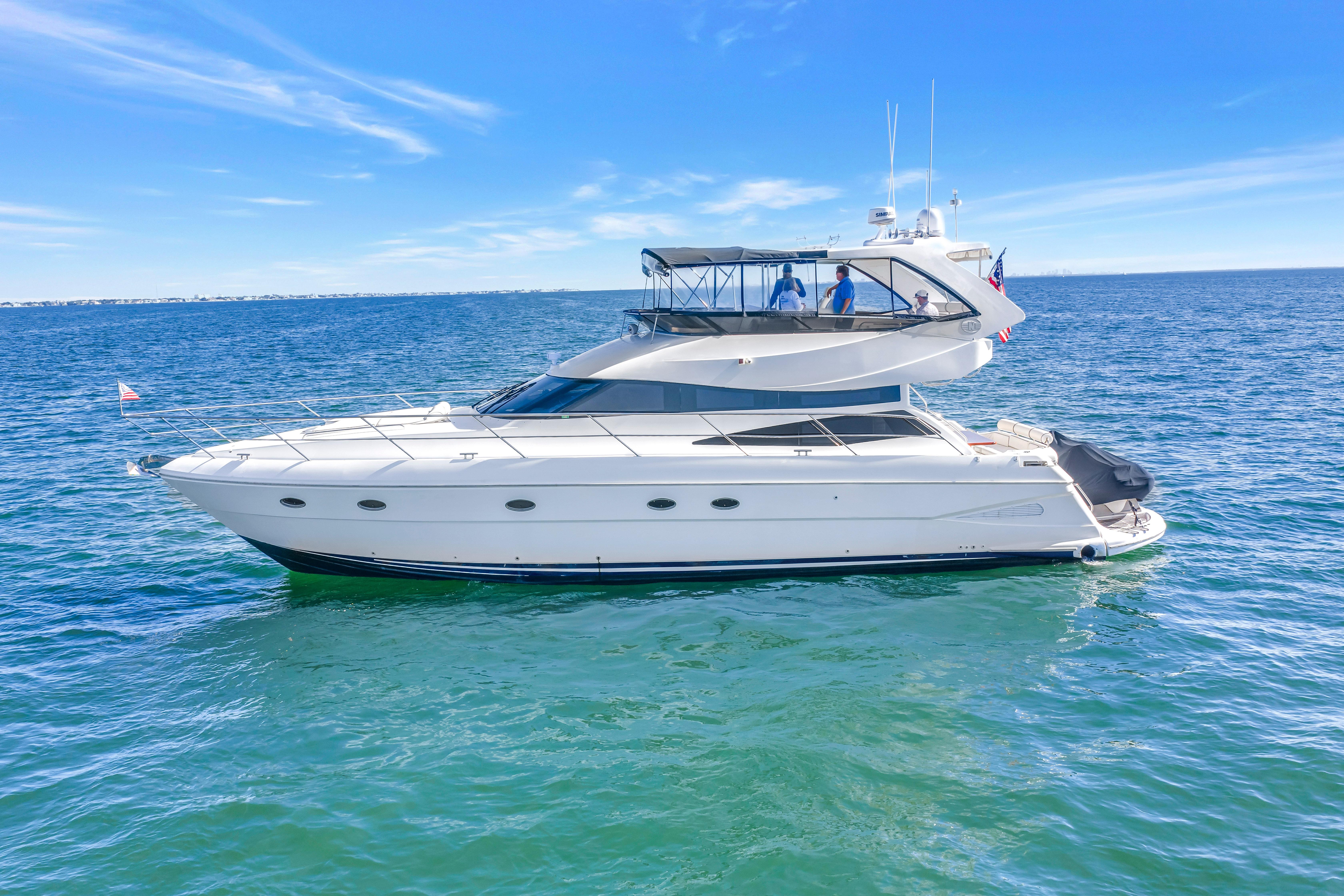 2001 Neptunus 56 Flybridge yacht cruising on open blue waters.