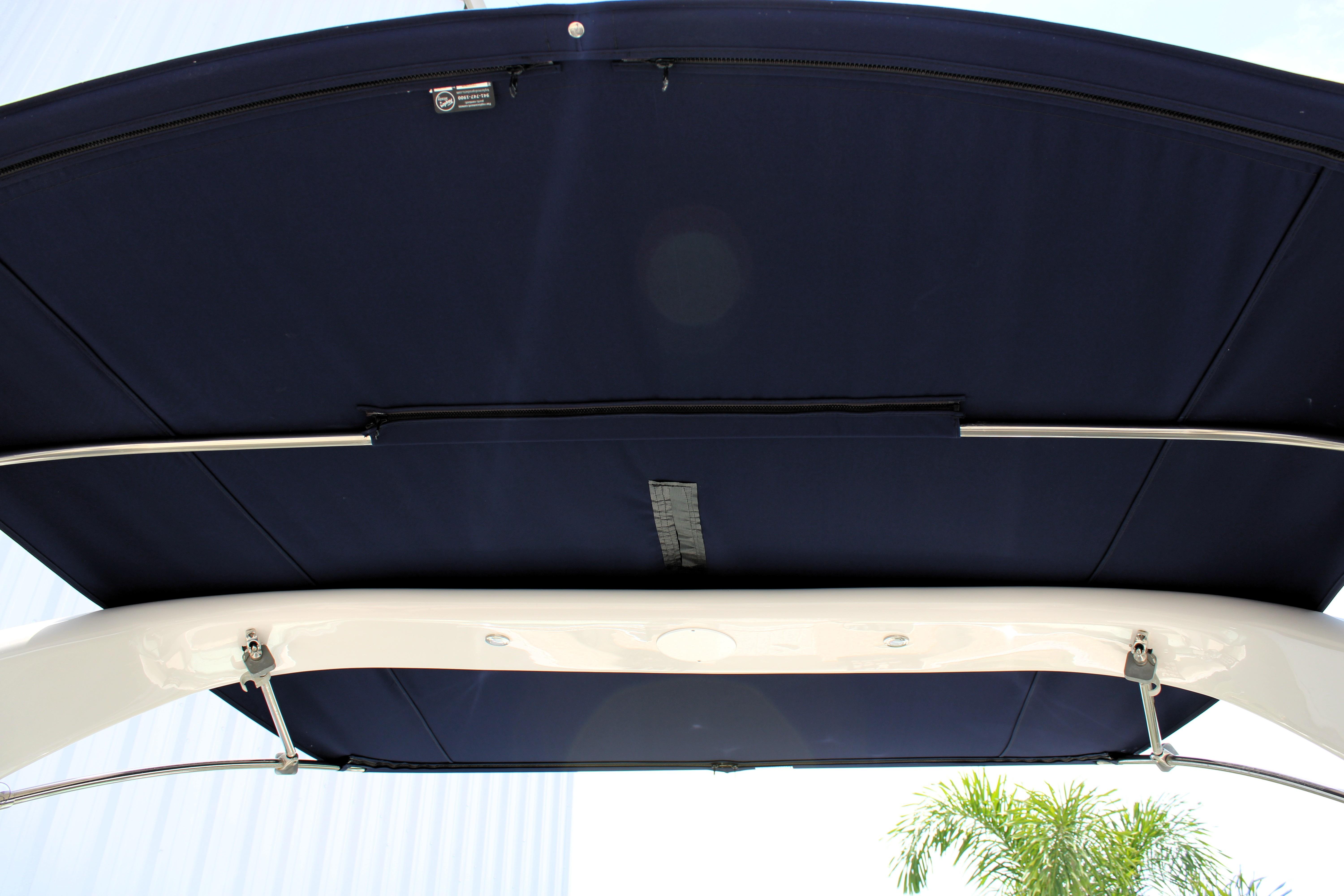 2021 Regal 26 OBX boat canopy, featuring a sleek navy blue design and sturdy metal frame.